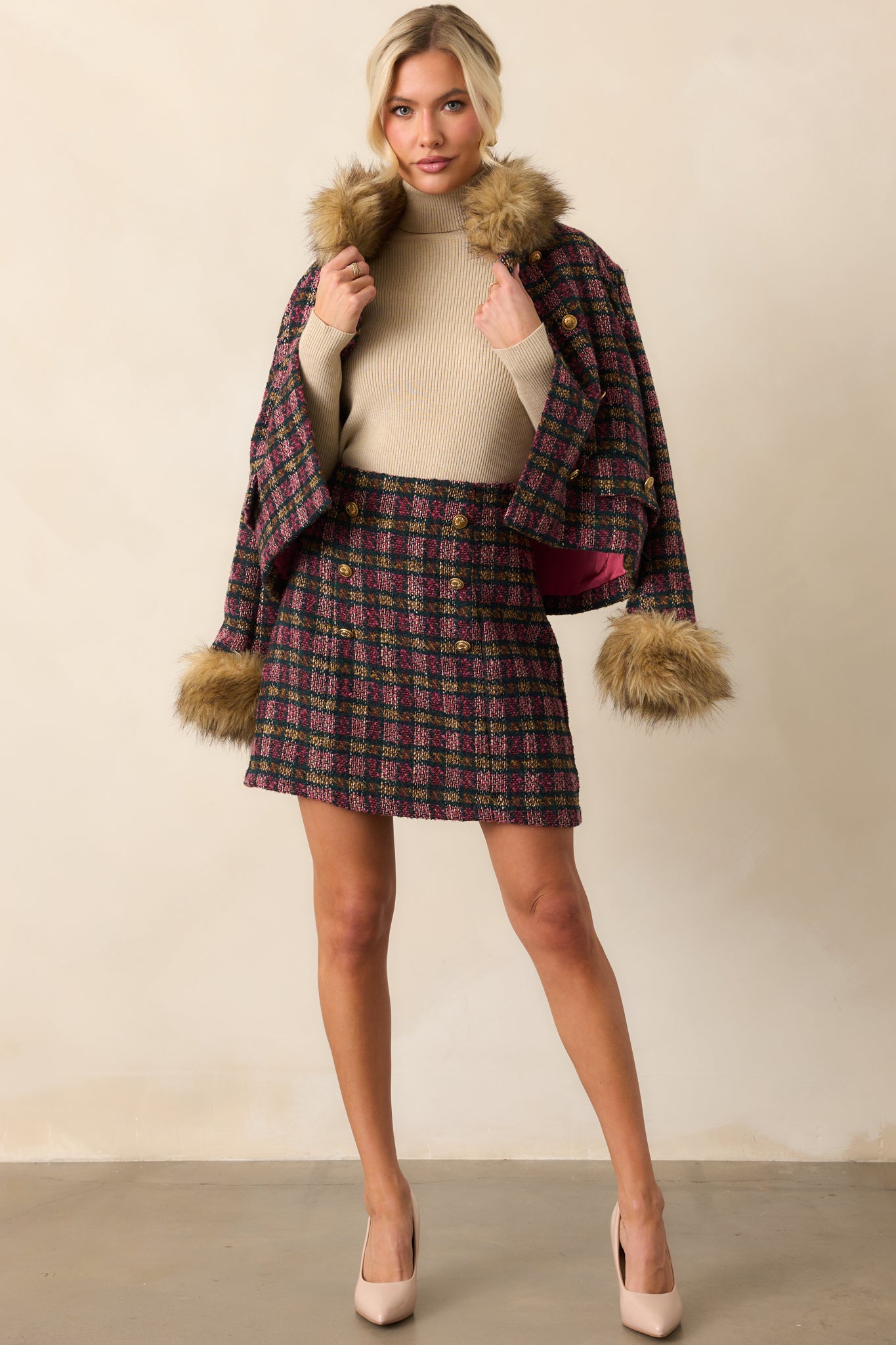 Pink multi-color plaid tweed mini skirt with a high-rise waist and double-breasted gold crest buttons.