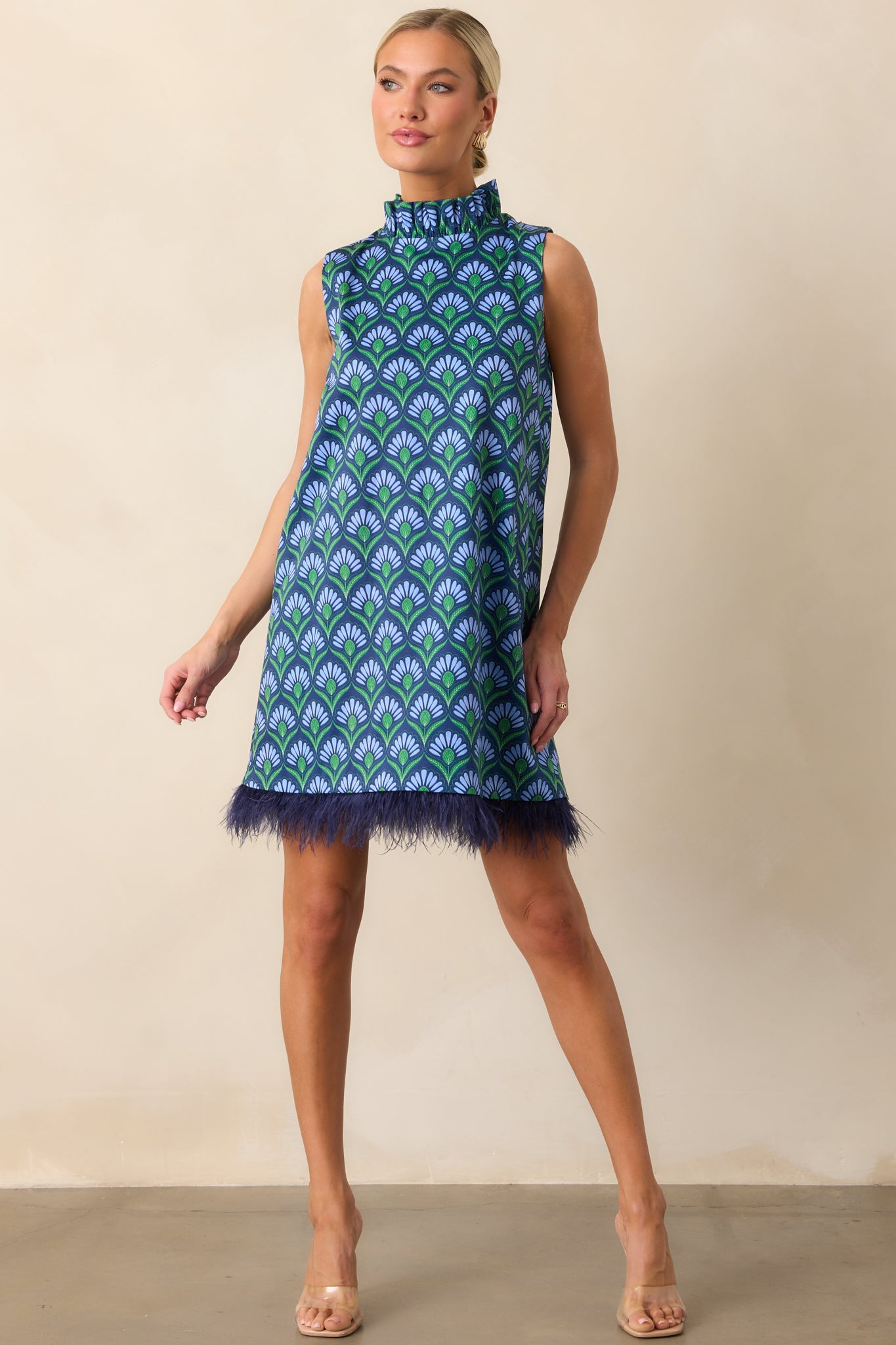 Geometric print mini dress highlighting the shift shape and vibrant multicolor pattern.