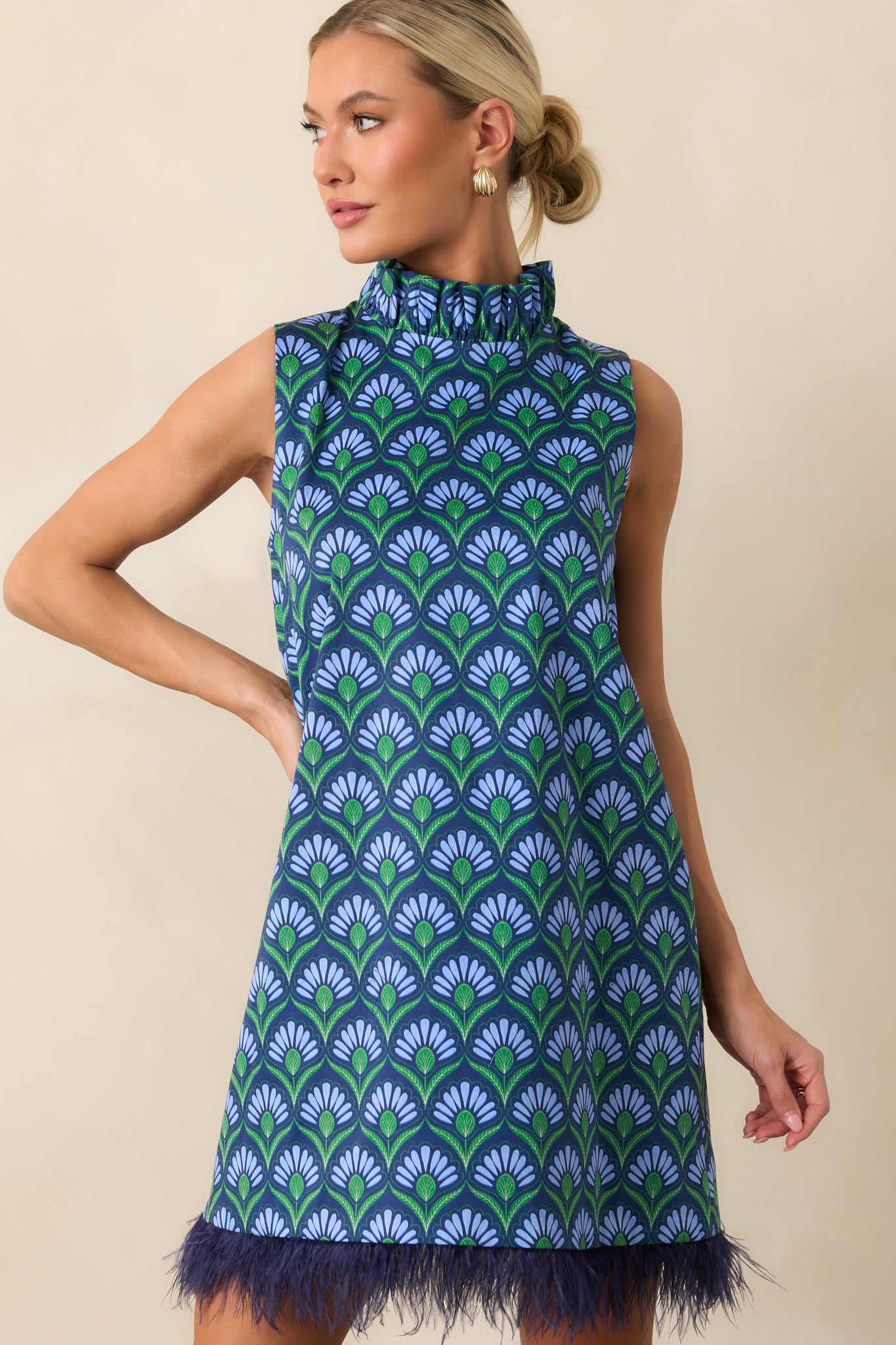 Detailed front view emphasizing the sleeveless design and multicolor geometric pattern.