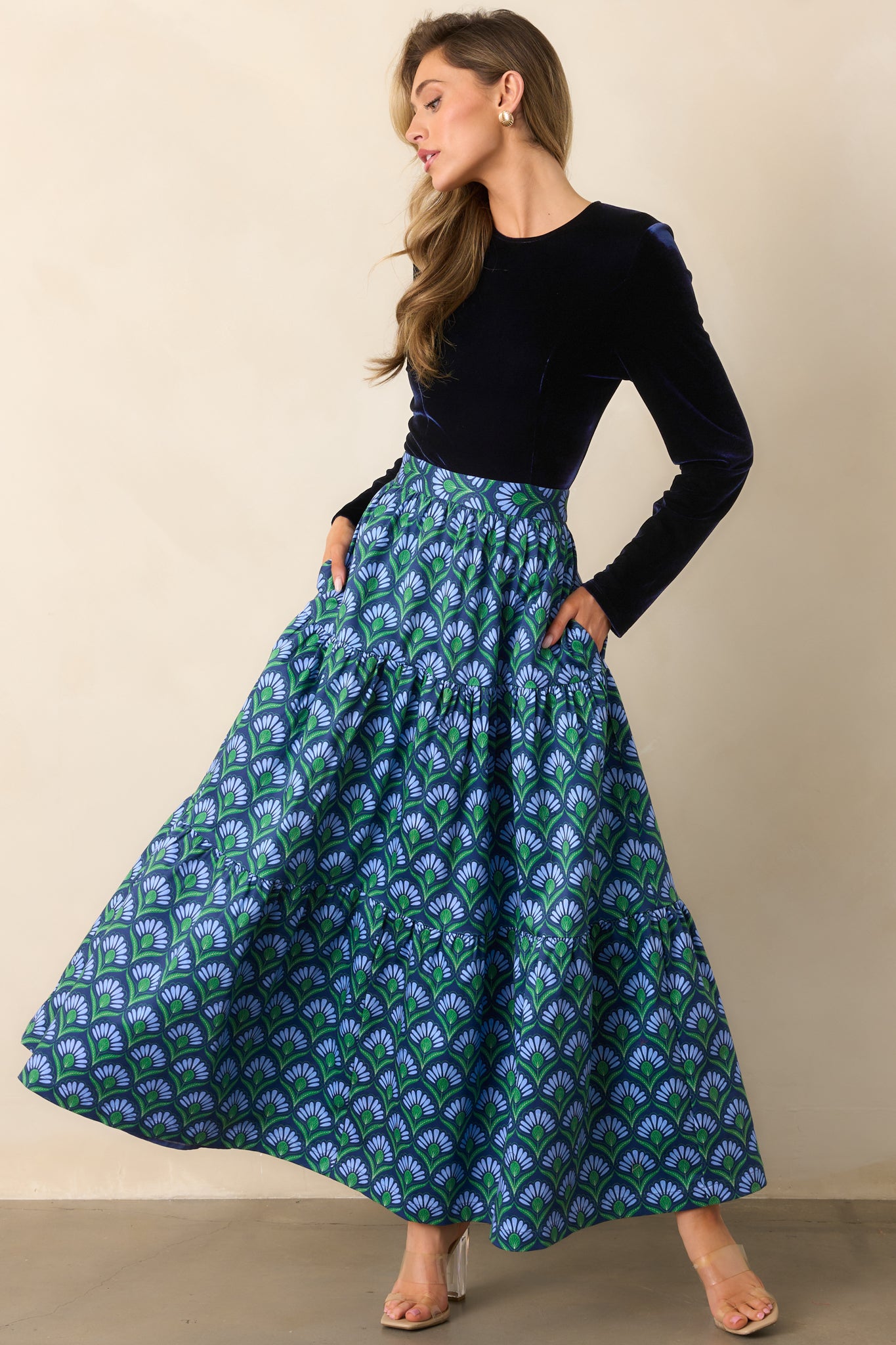 Dress featuring a tiered panel skirt in a blue multicolor geometric fan print and functional pockets