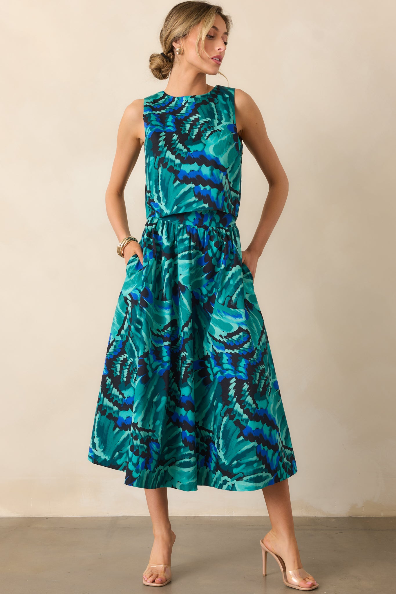 High-rise blue skirt featuring the abstract print and smooth, fully lined silhouette.