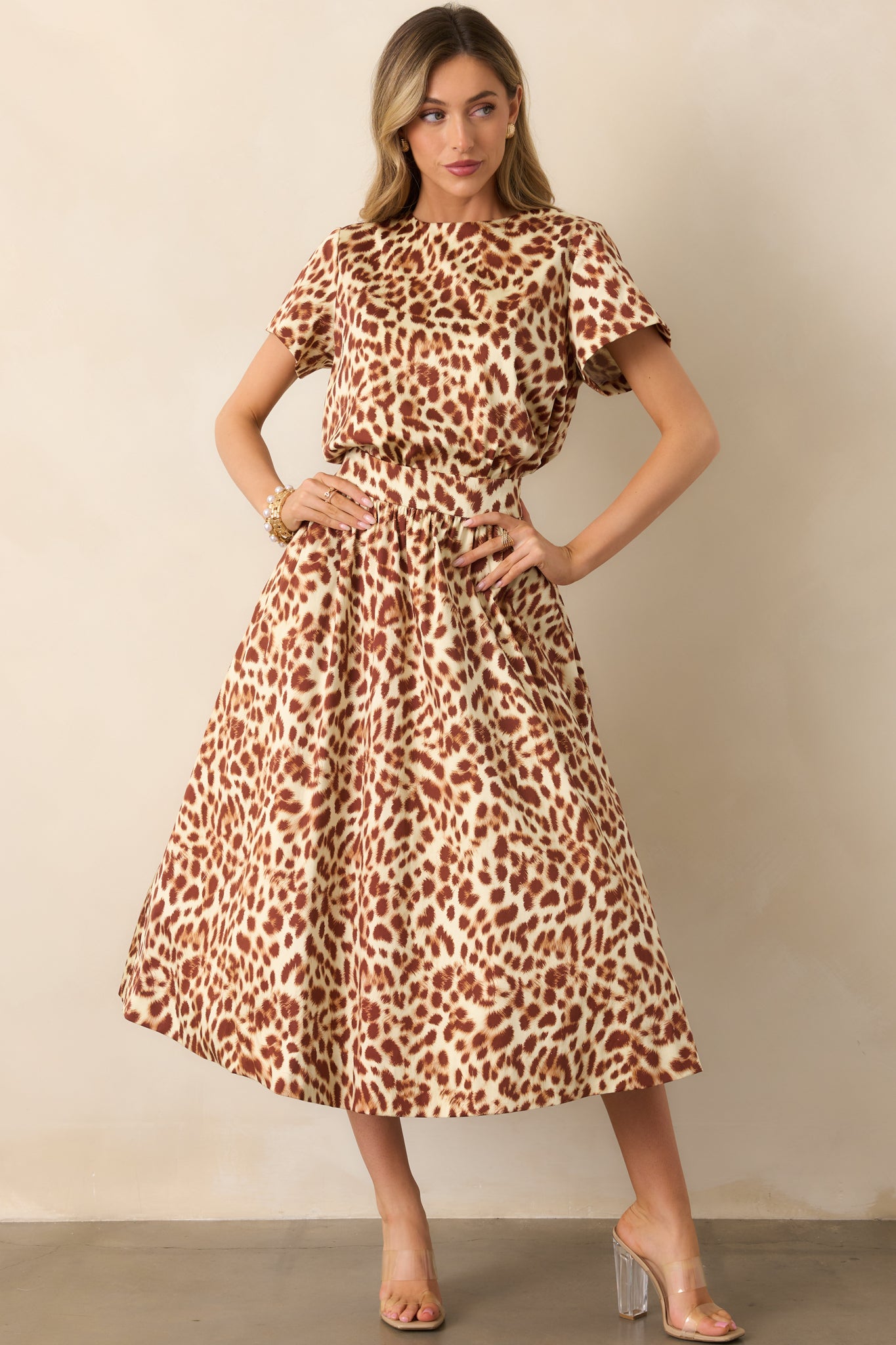 Leopard print midi skirt featuring functional pockets and an elastic back waist insert.