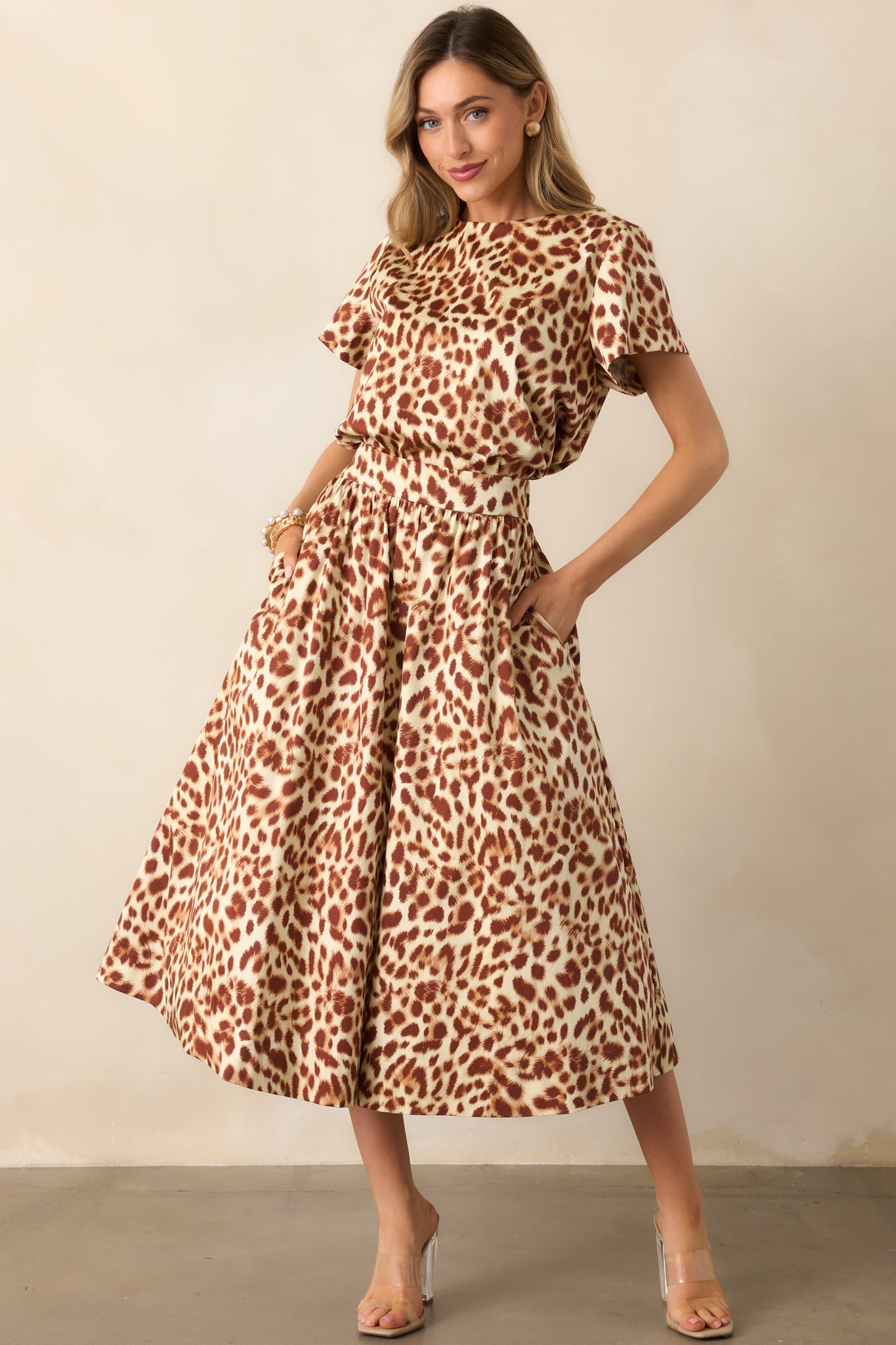 High-rise skirt highlighting the smooth fabric drape and full lining.