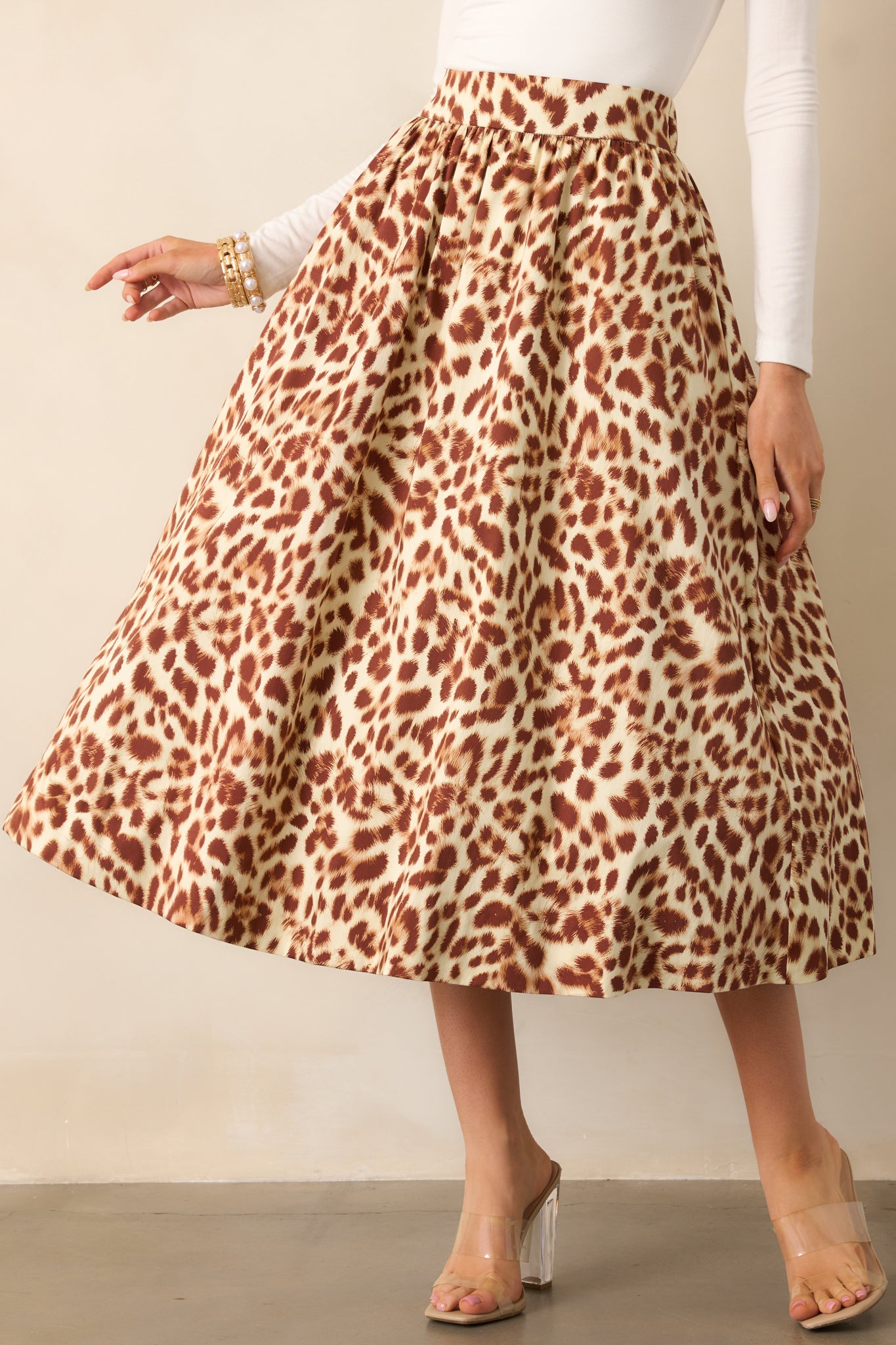Focus on the elastic back waist insert and textured leopard print pattern.