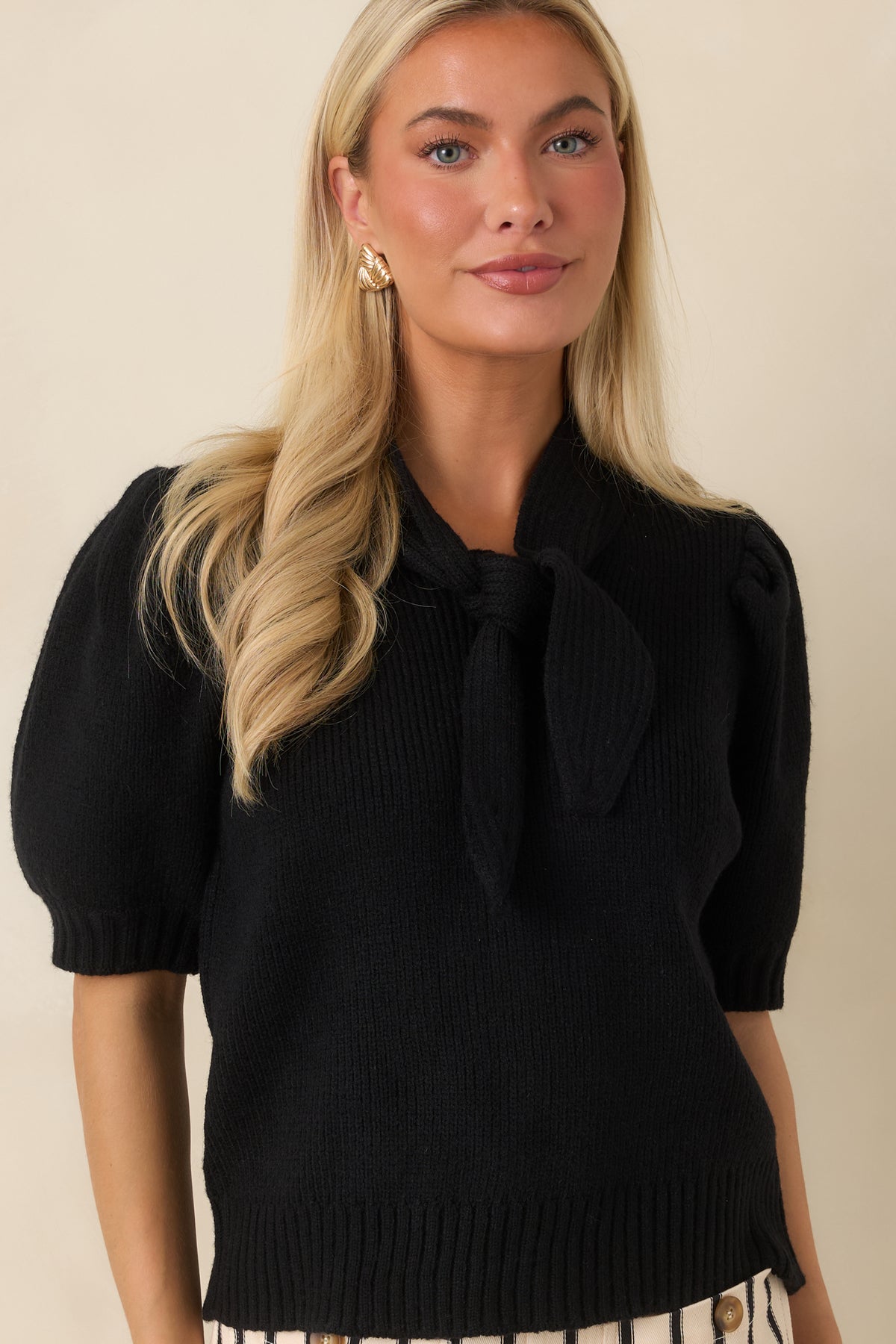 Close view of the puff sleeves highlighting the gathered shape and coordinating ribbed cuffs.