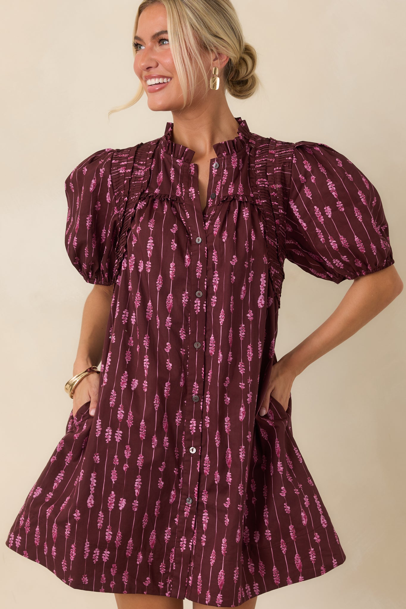 Detailed view of the puff sleeves showcasing pintucked shoulder accents and elasticized cuffs.