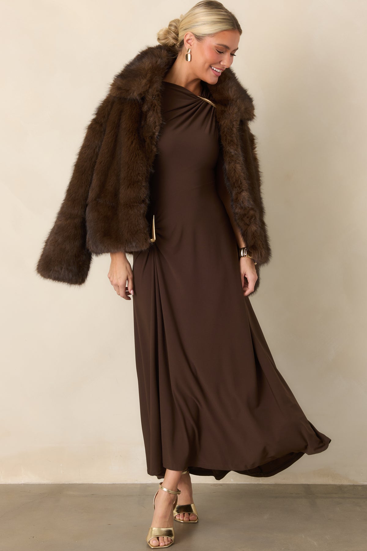 Pull-on maxi dress featuring an asymmetrical neckline, gathered hip, and eye-catching teardrop hardware.