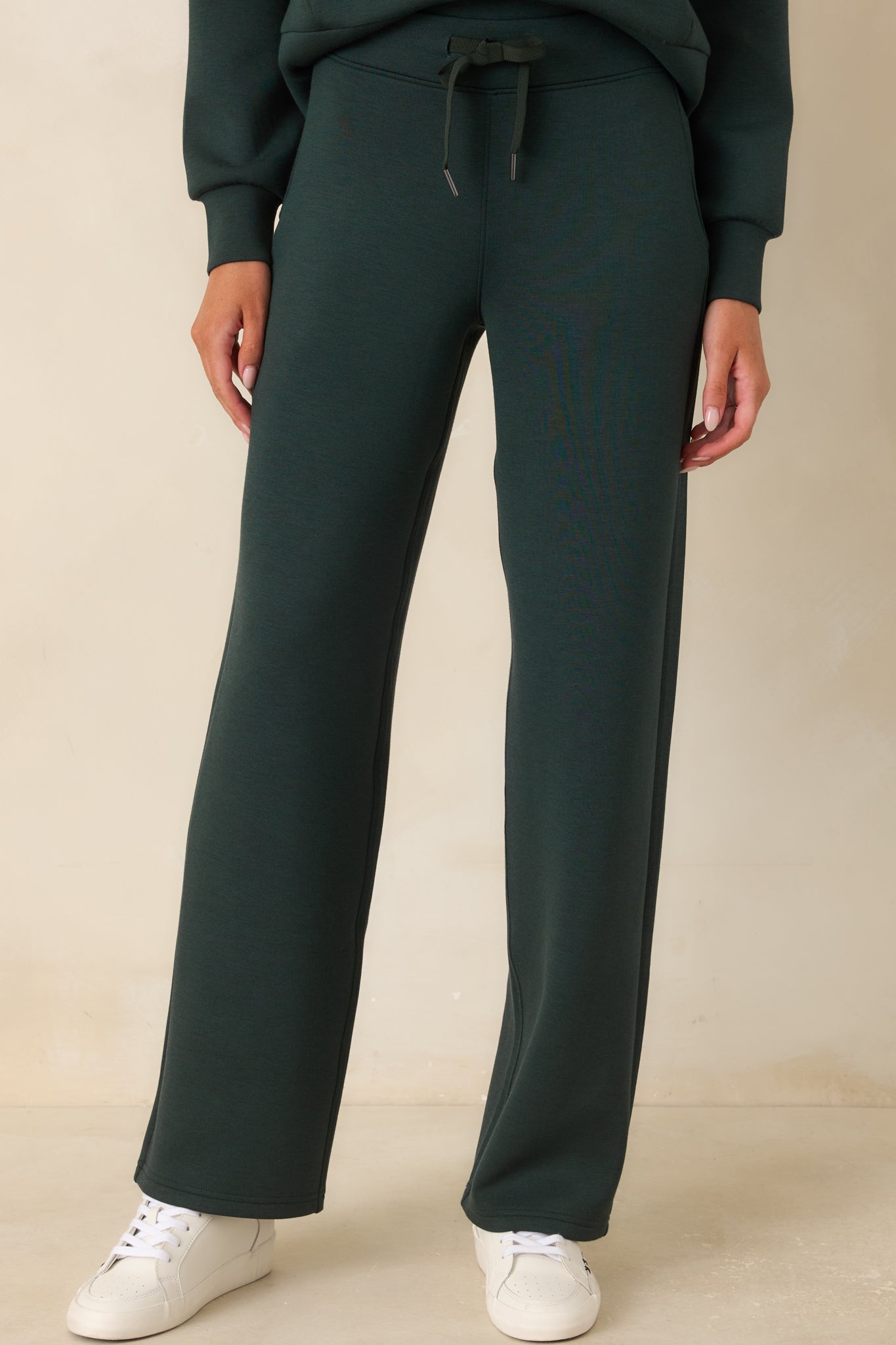 The front of these pull-on pants highlights the flat-front waistband and straight leg design.