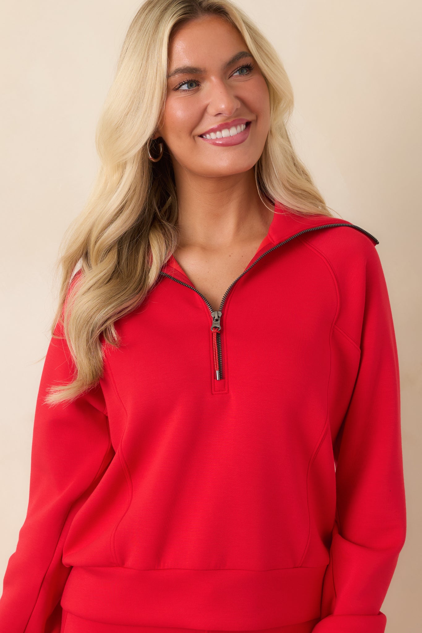 The front of this pullover highlights the oversized collar and half-zip neckline with clean seam detailing.