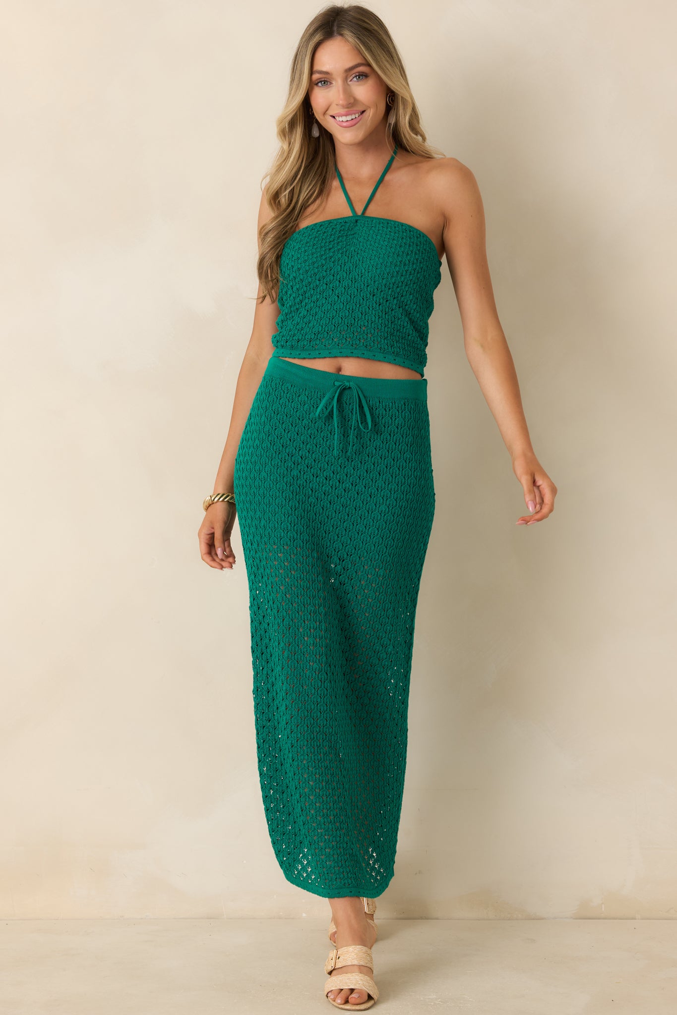 Rainforest green crochet cropped top featuring a straight neckline, fitted silhouette, and textured open-knit design.