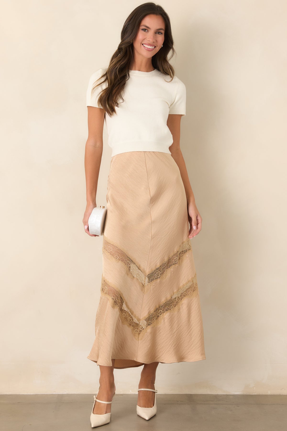 Rayon-blend knit top featuring a clean crew neckline and ribbed hem.