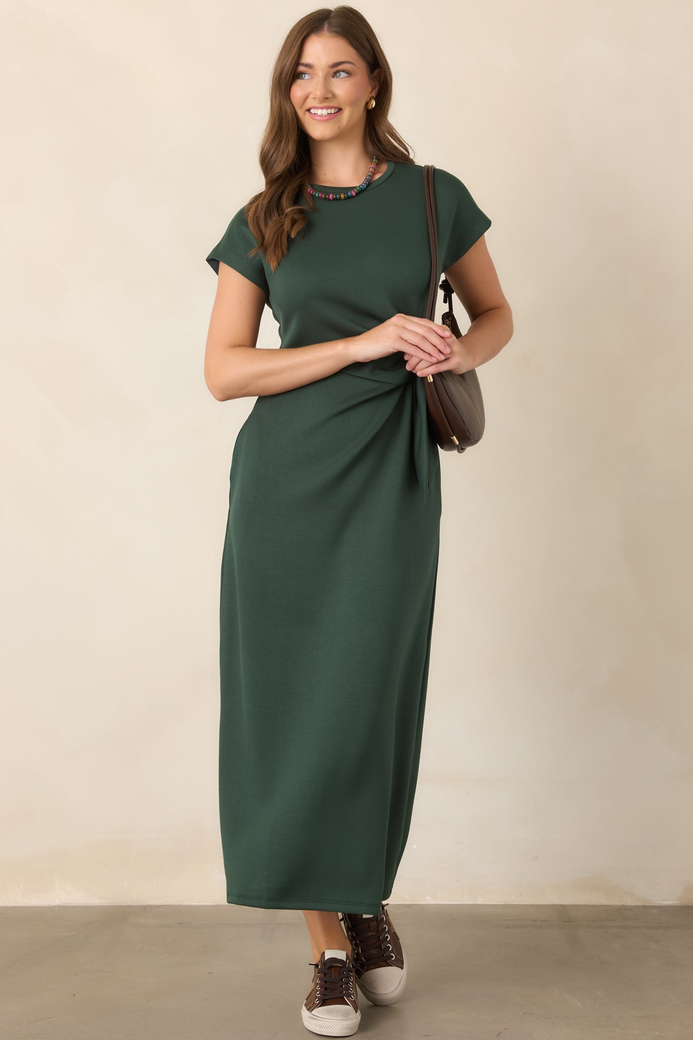 Rayon-blend midi dress featuring a smooth, buttery finish, comfortable stretch, softly draped silhouette, and waist knot for subtle definition.
