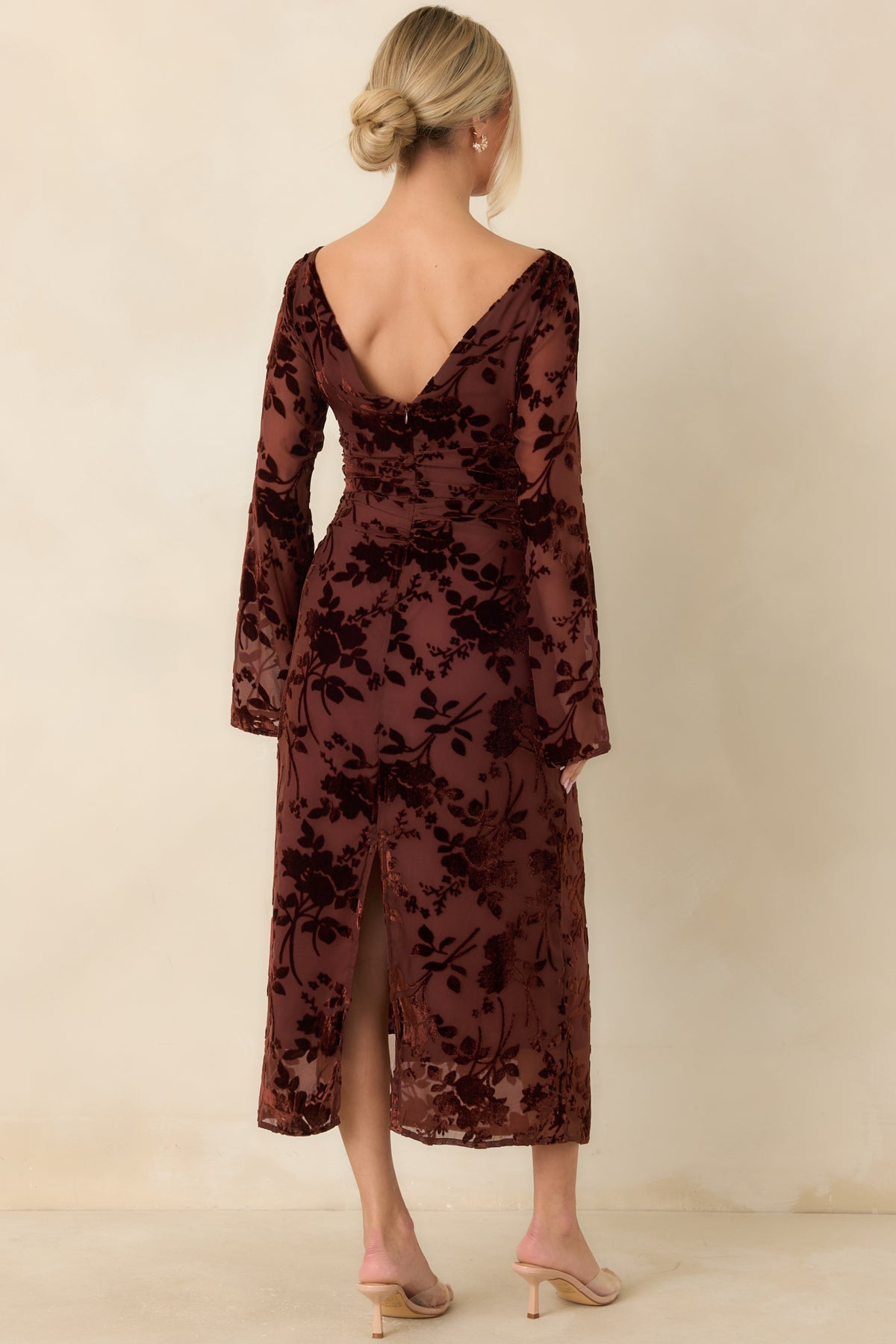 Rear of the burgundy floral burnout midi dress featuring a deep V-back, concealed zipper, and sheer long sleeves.