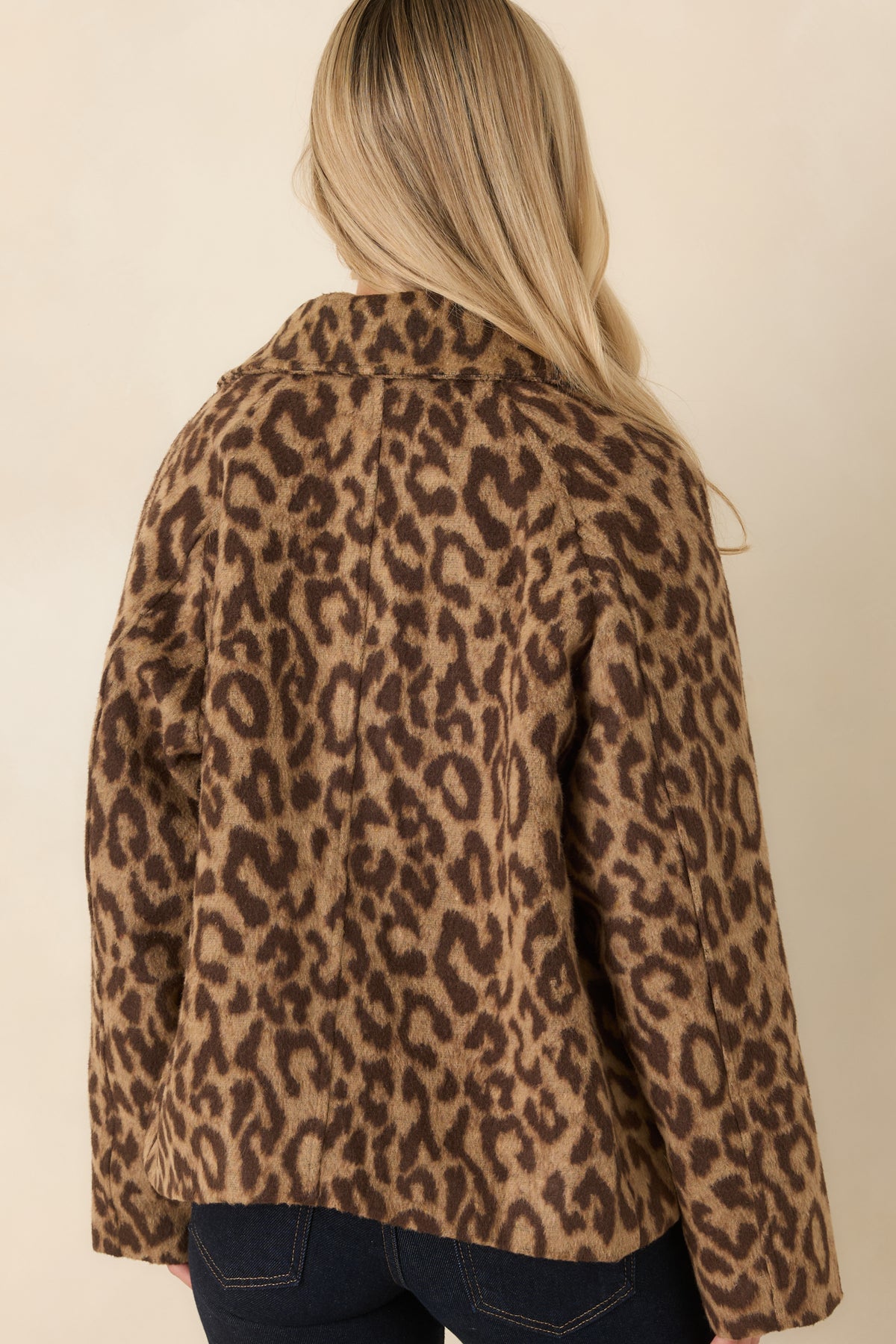 Rear view of the camel leopard print jacket featuring a relaxed boxy silhouette, long sleeves, and soft brushed texture.