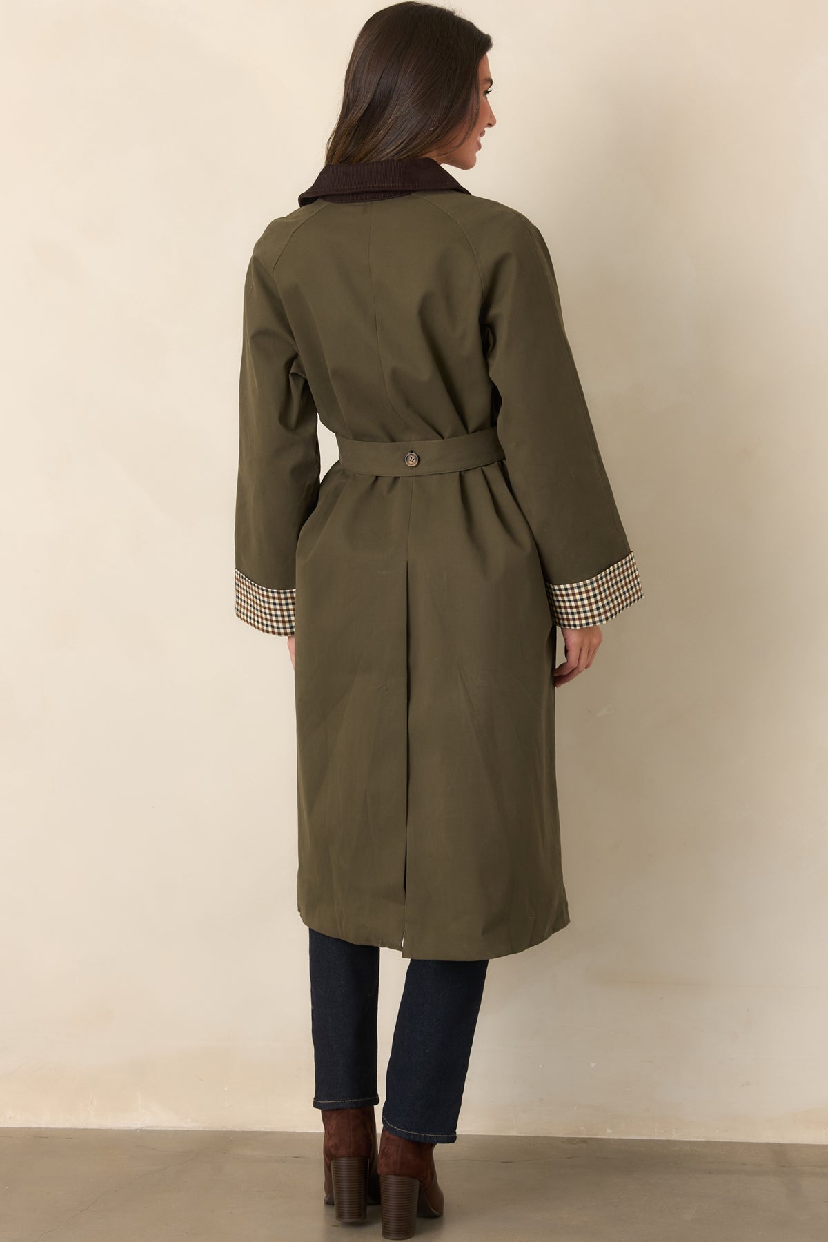 Rear view of the coat highlighting the long back vent and smooth canvas-feel construction.
