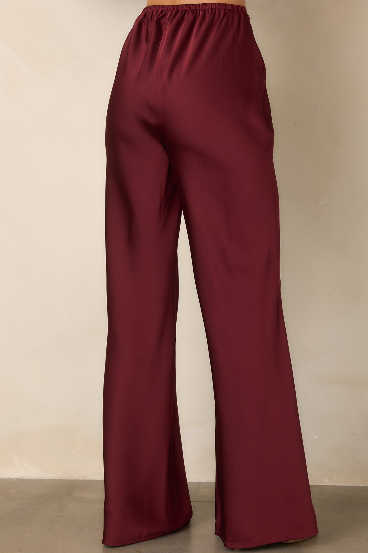 Rear view of the pants showing the elasticized waistband and full-length wide-leg silhouette.
