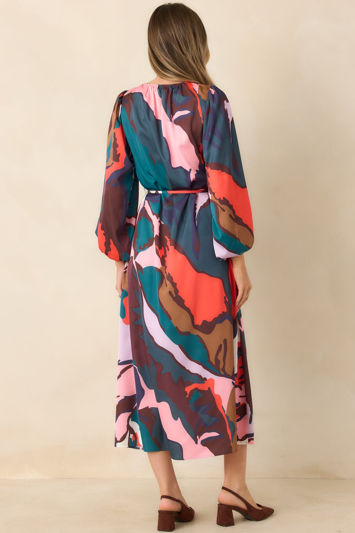 Rear view of the Leaf Study midi dress featuring oversized multicolor botanical shapes, voluminous three-quarter sleeves, and a flowing silhouette.