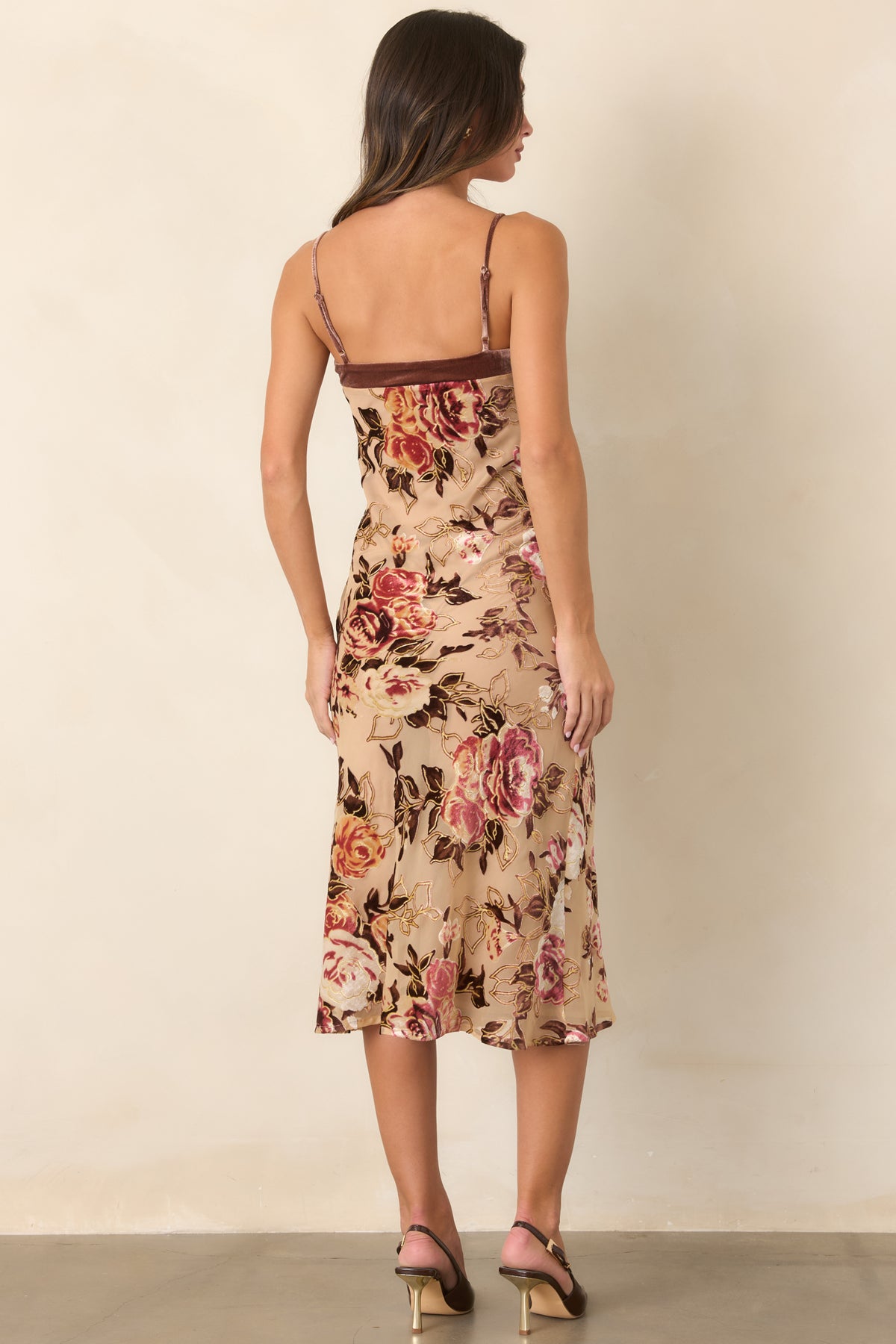 Rear view of the mocha floral burnout midi dress showing the sheer outer layer, velvet rose pattern, adjustable straps, and gently flared hem.