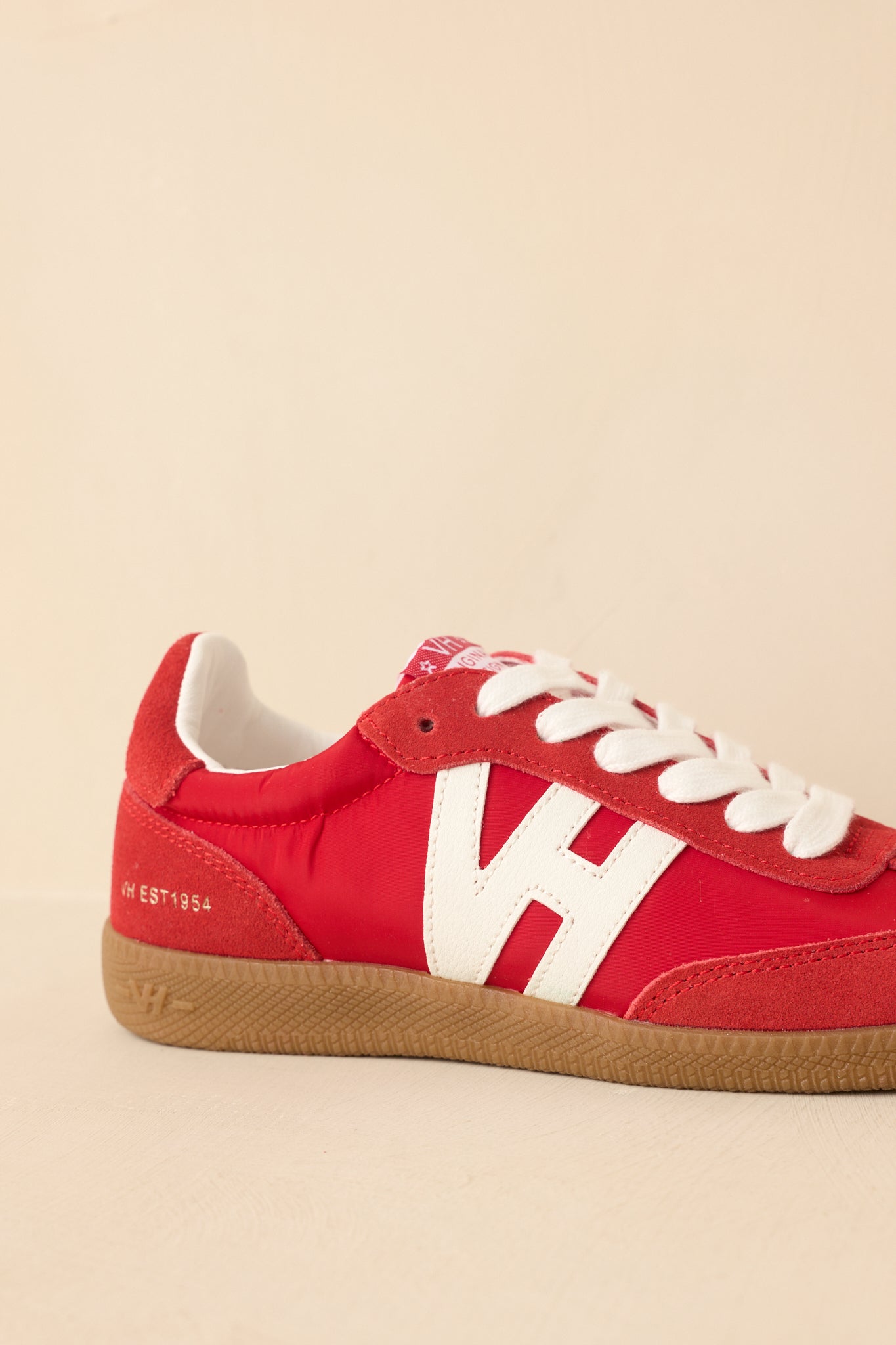 Angled rear-side view showing heel counter and suede accents.