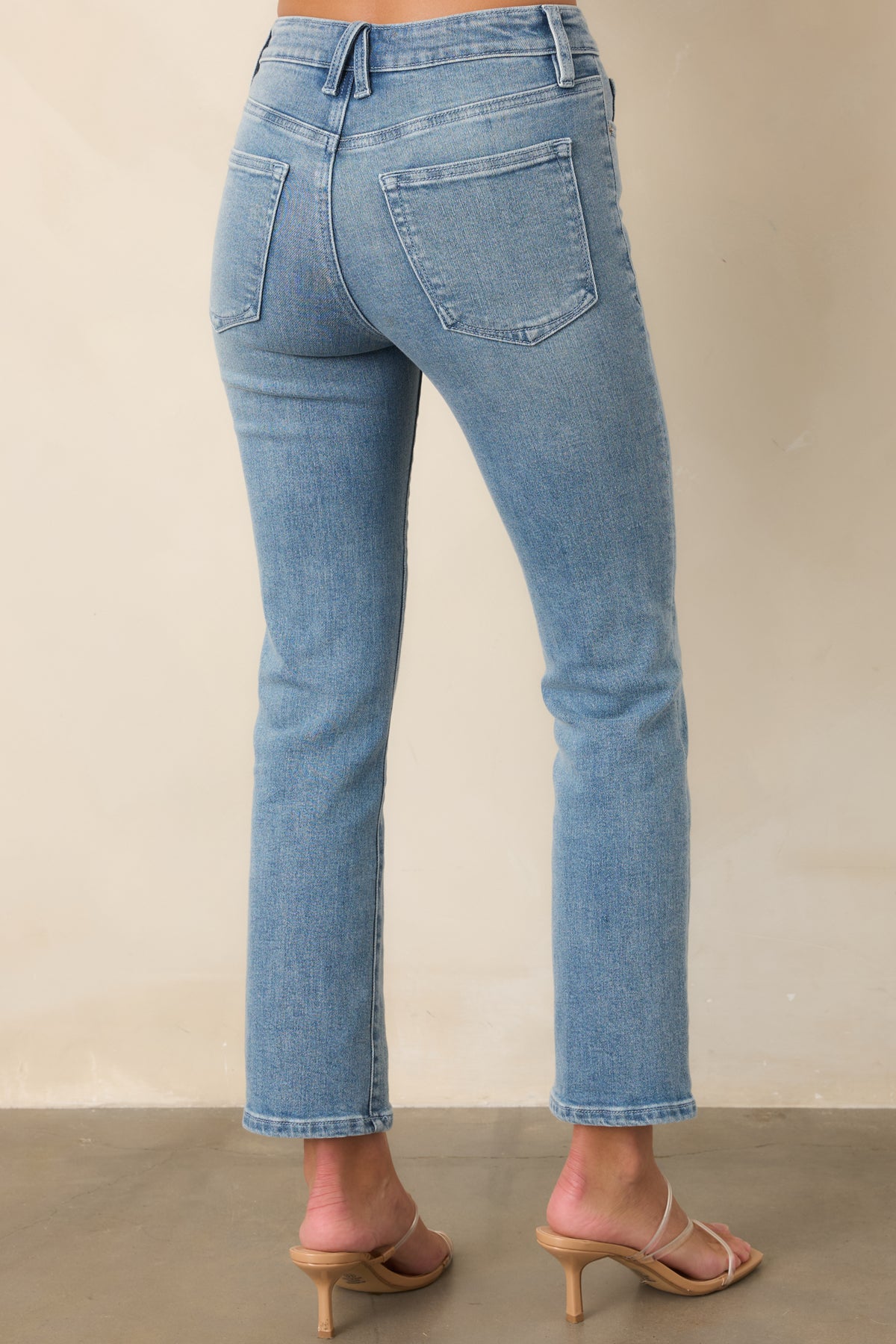 Rear of the slim-straight pants showing the gap-proof waistband, contoured fit through the hips, and back pockets.