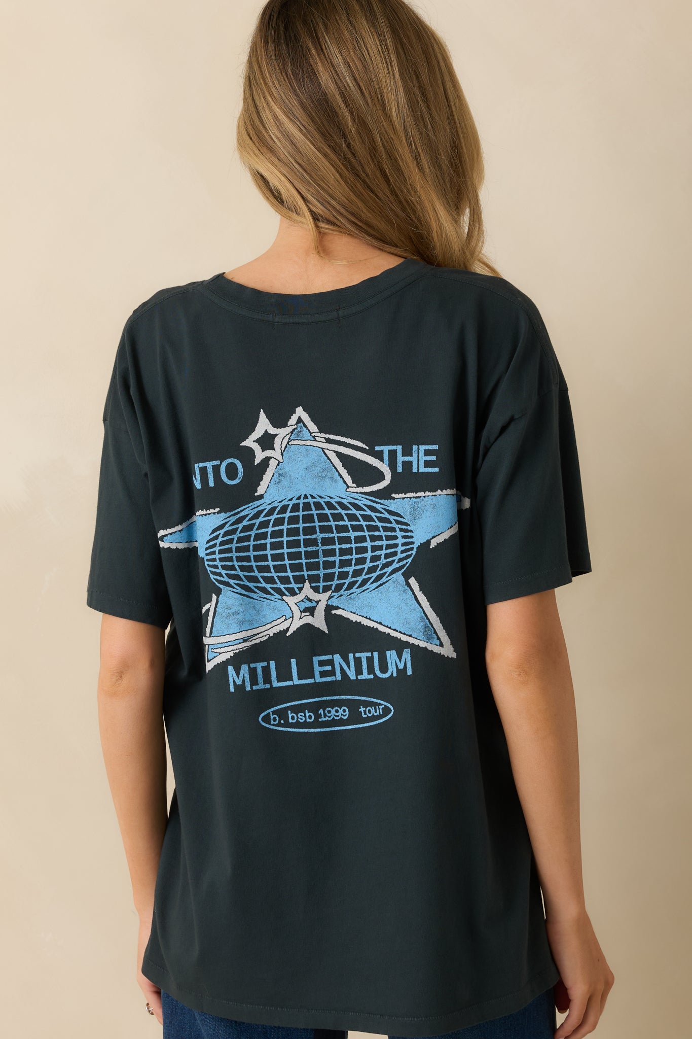 Rear view of the black cotton tee showing the simple solid back and relaxed unisex fit.