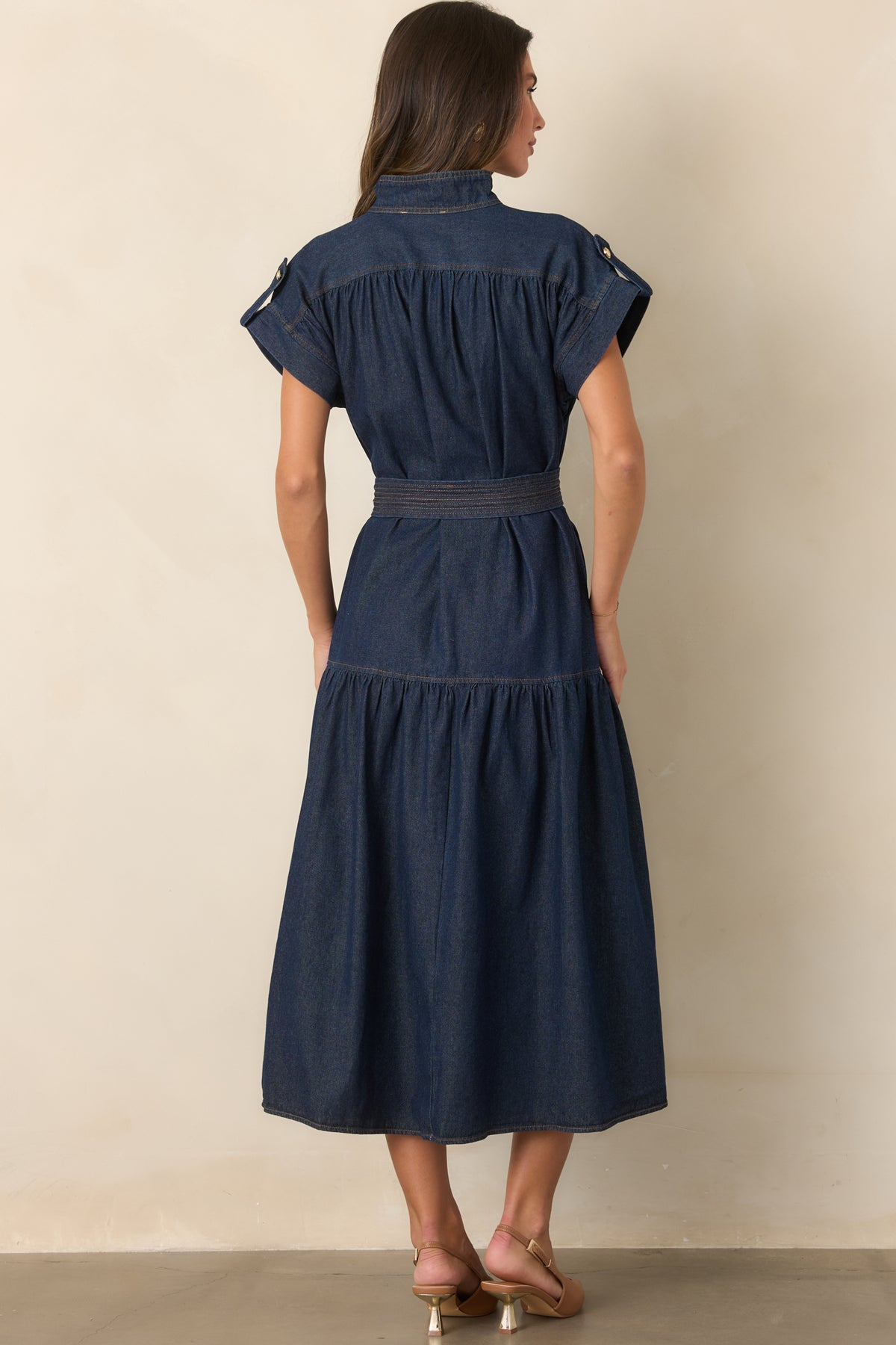 Rear view of the cotton-rich dress with a defined belted waist and full gathered tier.