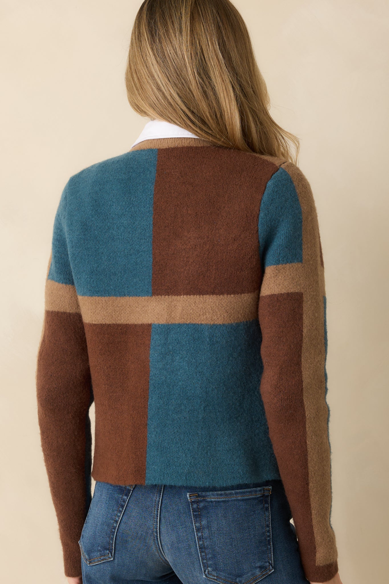 Rear view of the color block cardigan displaying a relaxed fit and clean knit finish.
