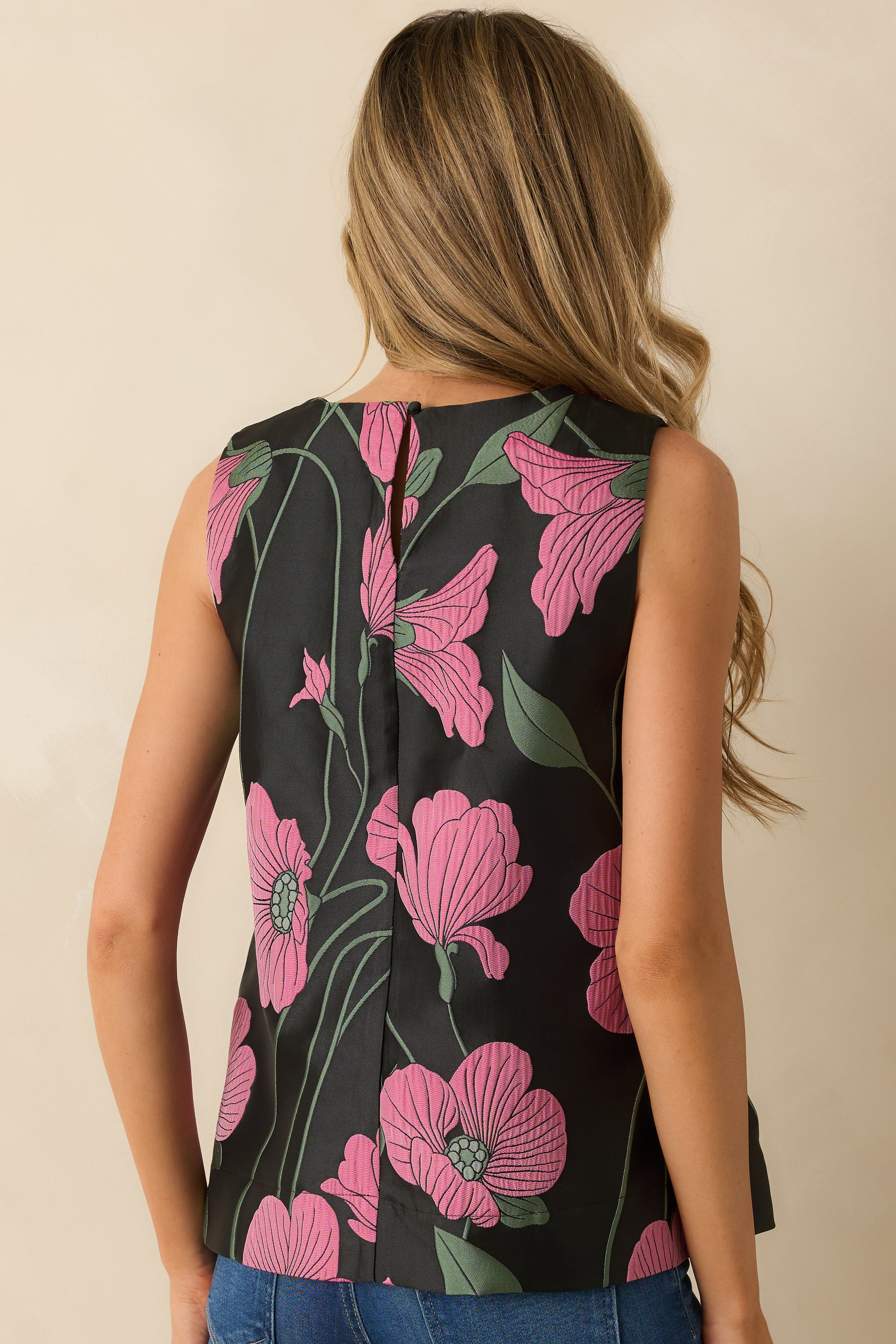 Rear view of the floral jacquard top featuring a concealed zipper and clean, structured fit.