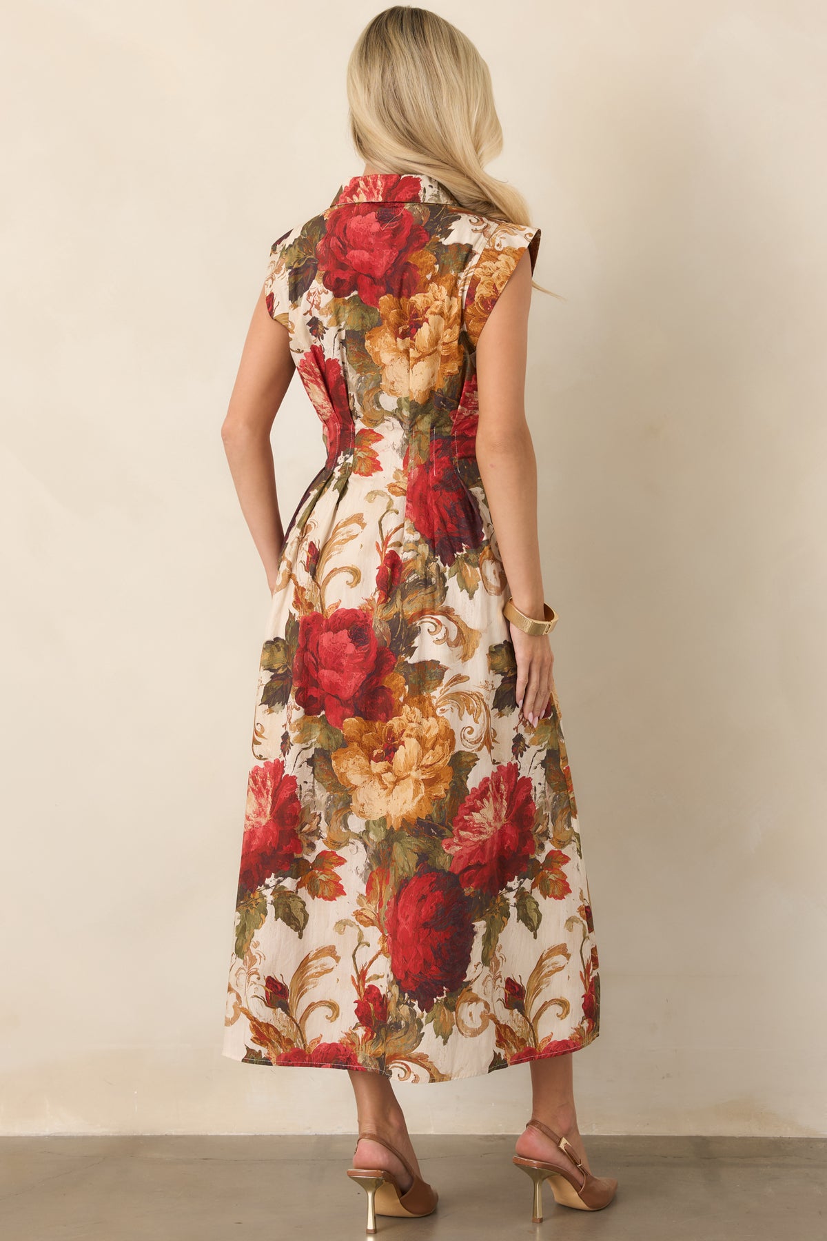 Rear view of the ivory floral dress featuring a fitted bodice and A-line skirt.