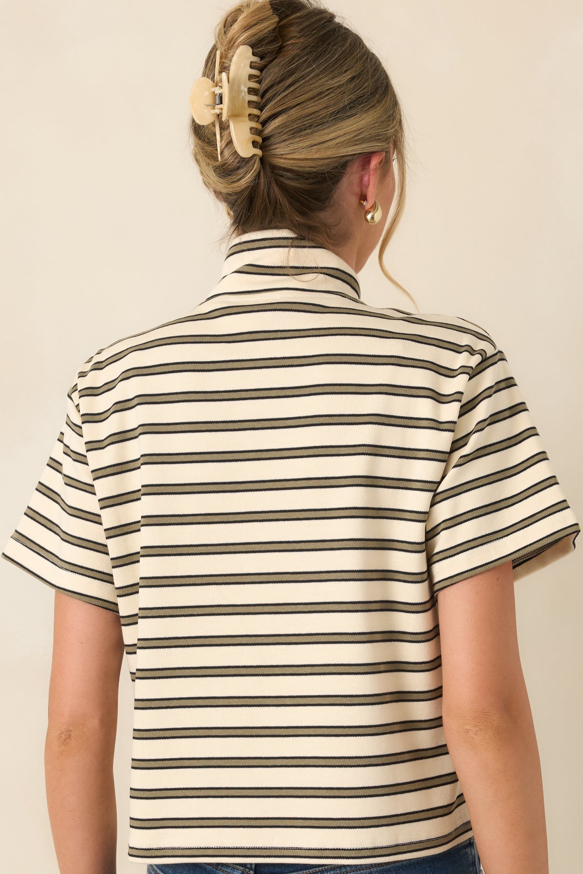 Rear view of the ivory short sleeve tee featuring slim olive horizontal stripes, relaxed fit, and soft cotton-blend construction.