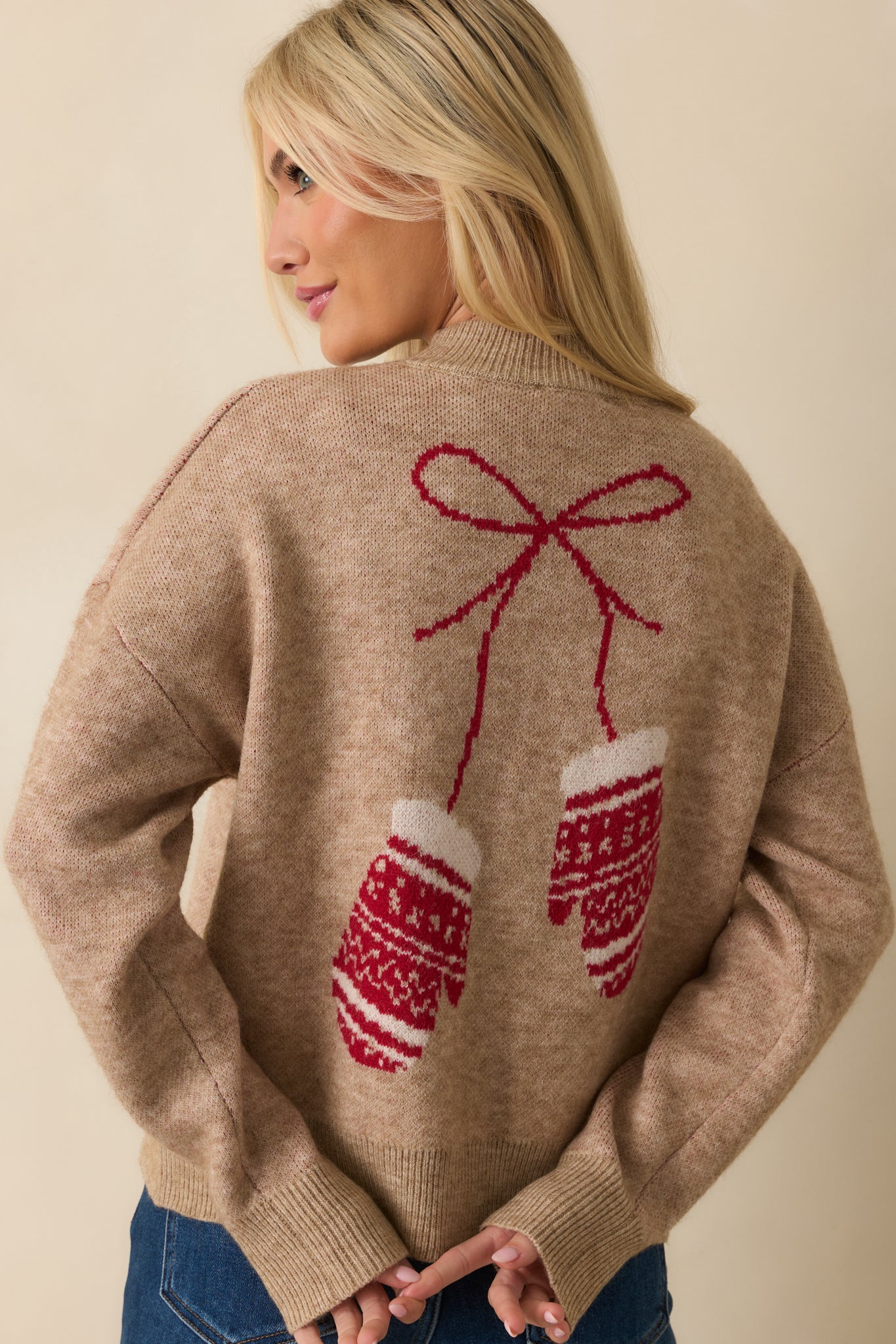 Rear view of the mocha knit sweater showing the relaxed silhouette and ribbed trim at the neckline, cuffs, and hem.