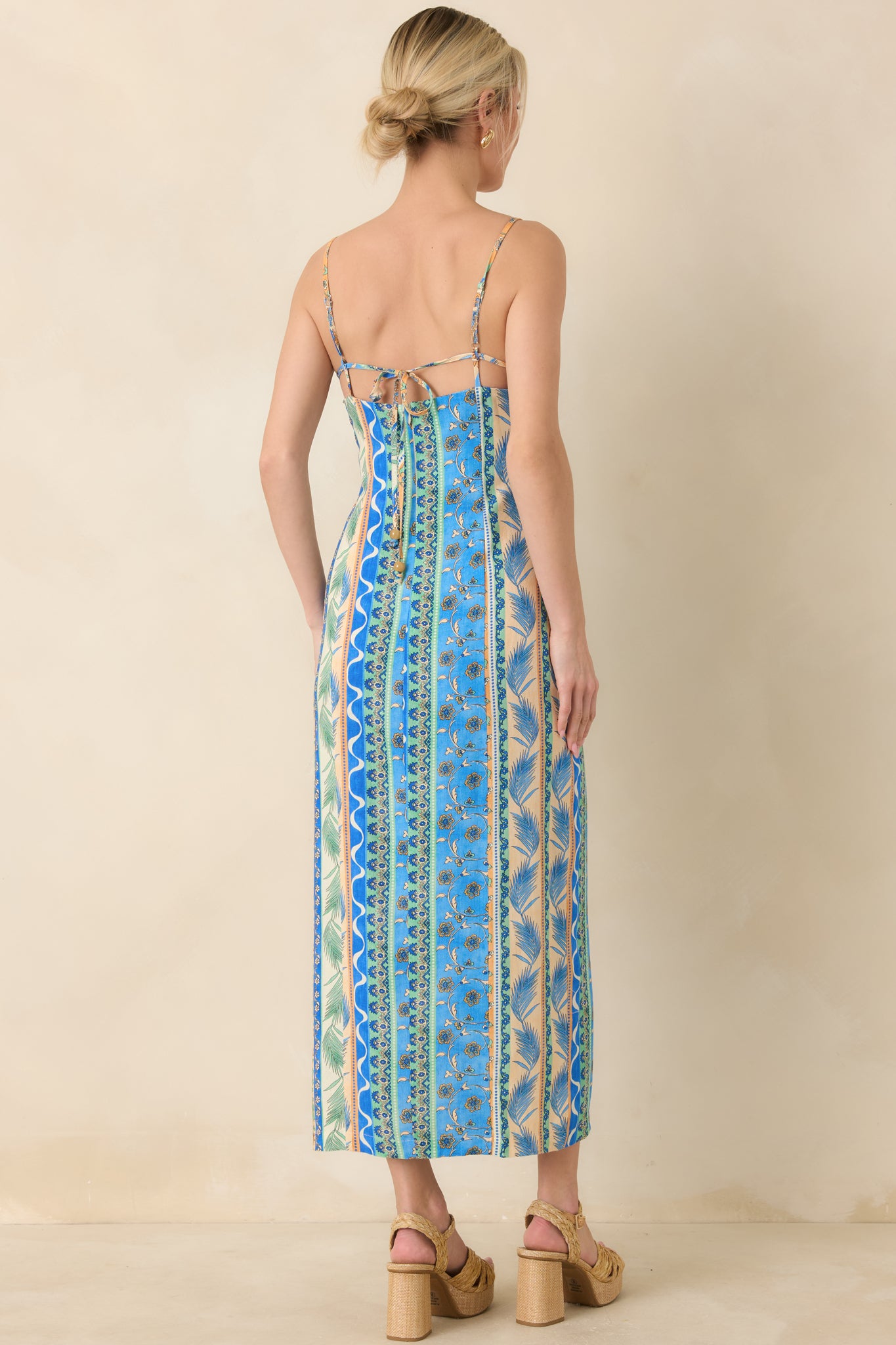 Rear view of breezy dress with relaxed silhouette and flowing shape.