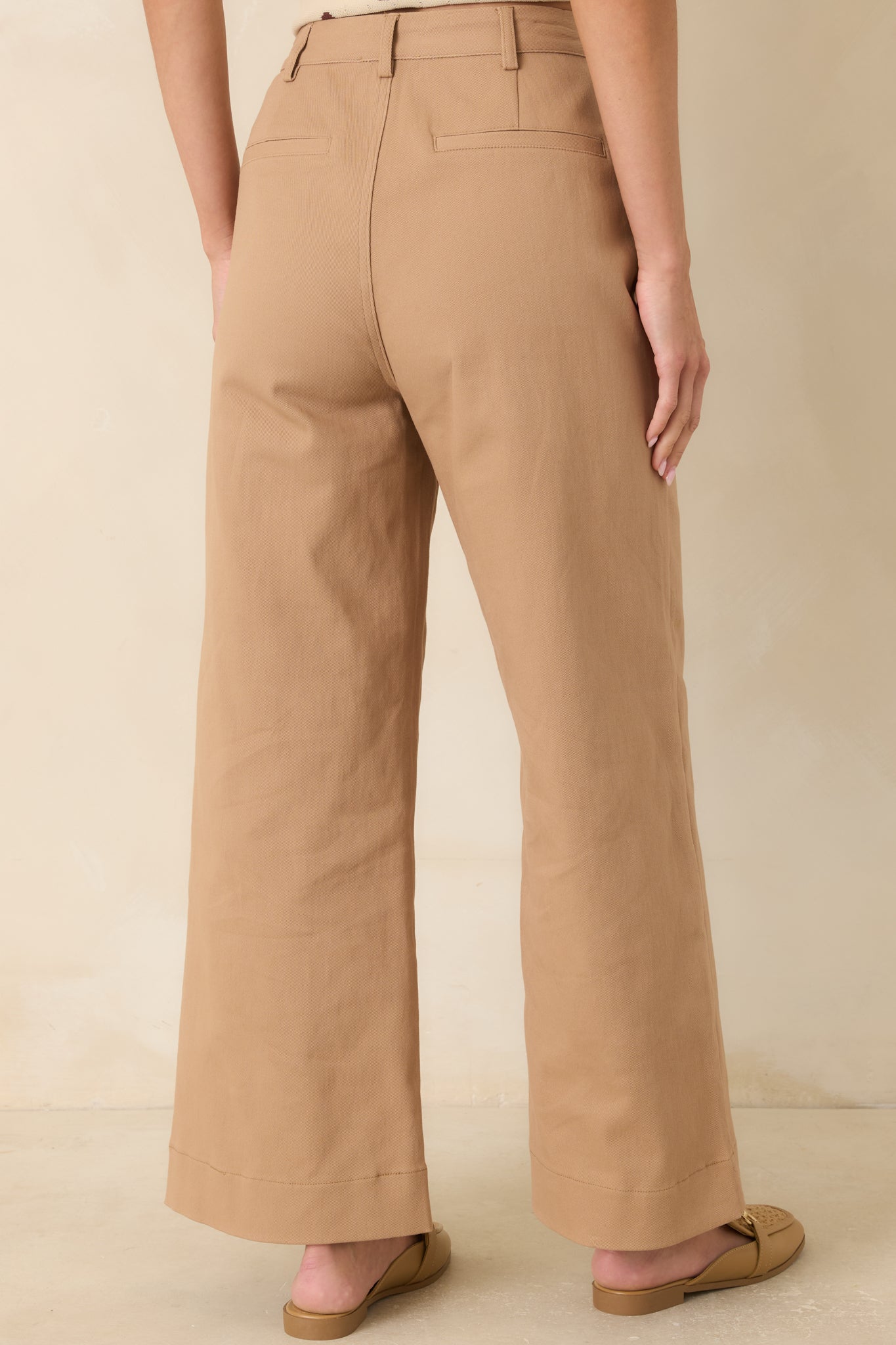 Rear view of the camel wide-leg pants showcasing the clean back design, belt loops, and tailored silhouette.
