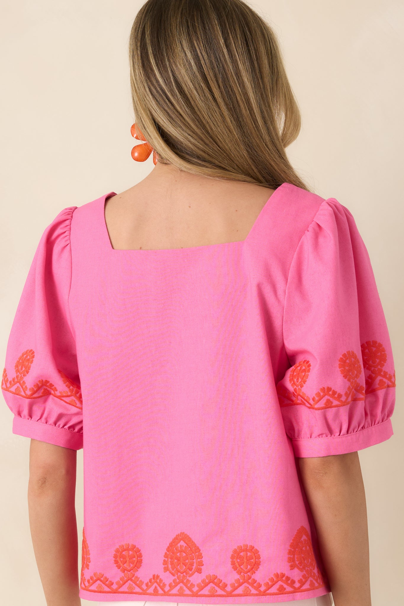 Rear view of cotton linen-blend top with relaxed boxy silhouette and clean, breathable design.