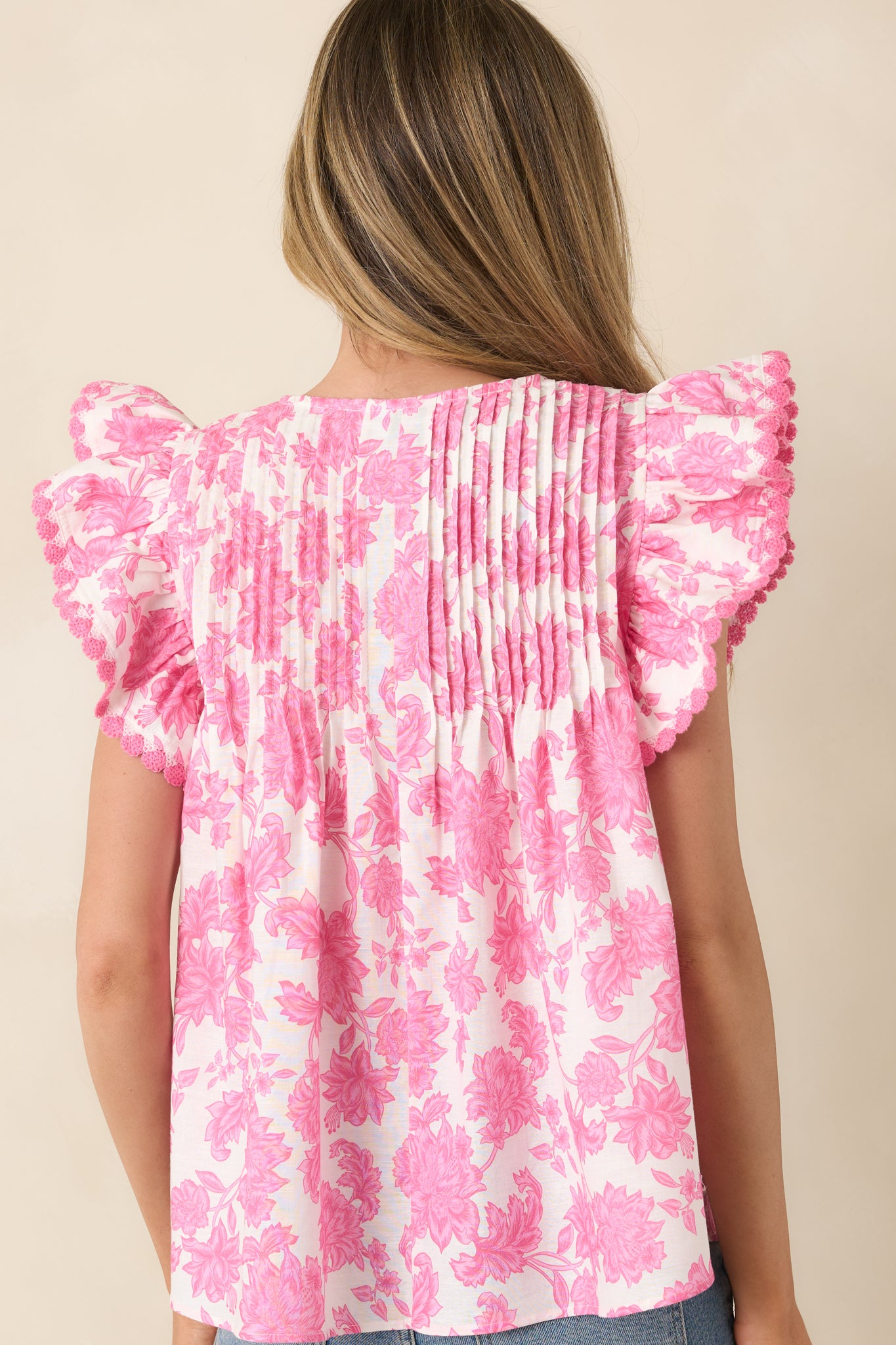 Rear view of floral top with relaxed silhouette and soft, flowing shape.