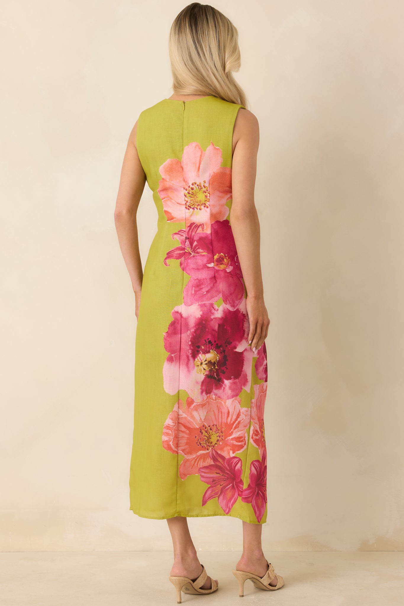 Rear view of green floral midi dress with concealed zipper and continuous print.