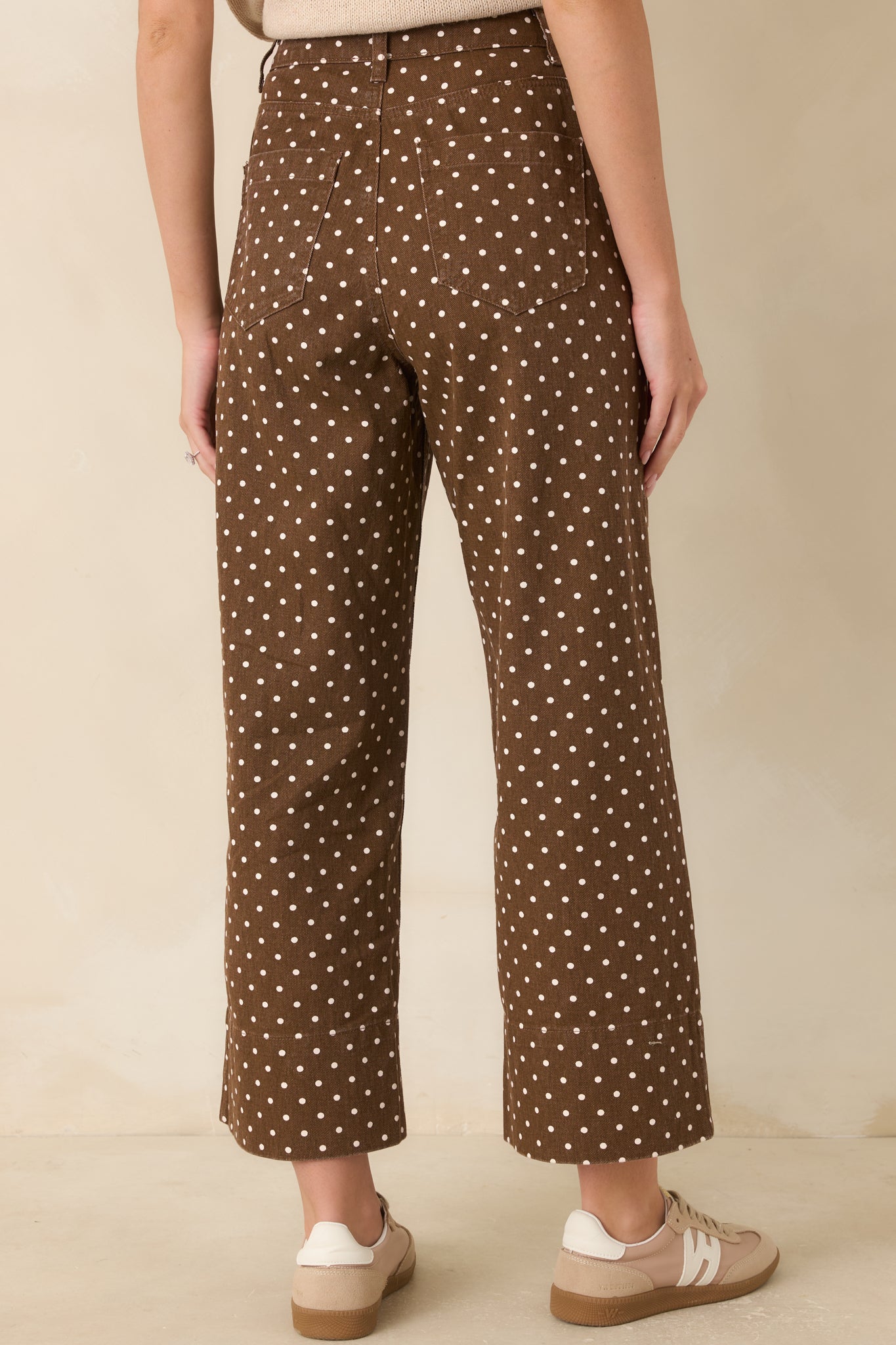 Rear view of the cotton pants showcasing back patch pockets and clean structured tailoring.