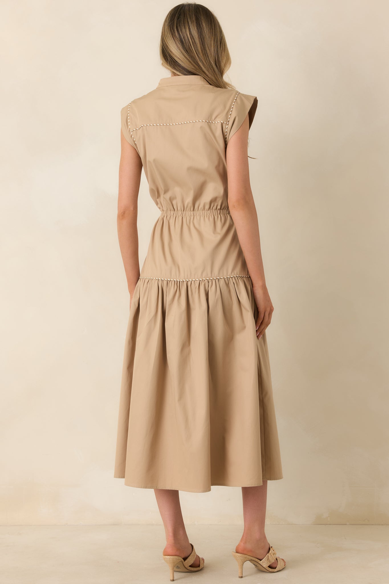 Rear view of midi dress with gathered skirt, cap sleeves, and adjustable waist tie