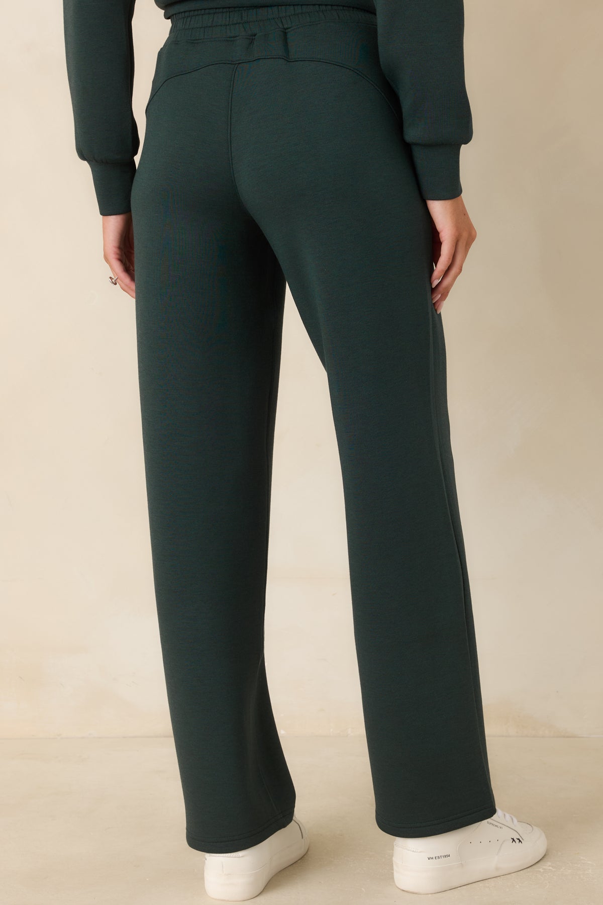 Rear view of the pants showcasing the relaxed silhouette and clean, streamlined construction.