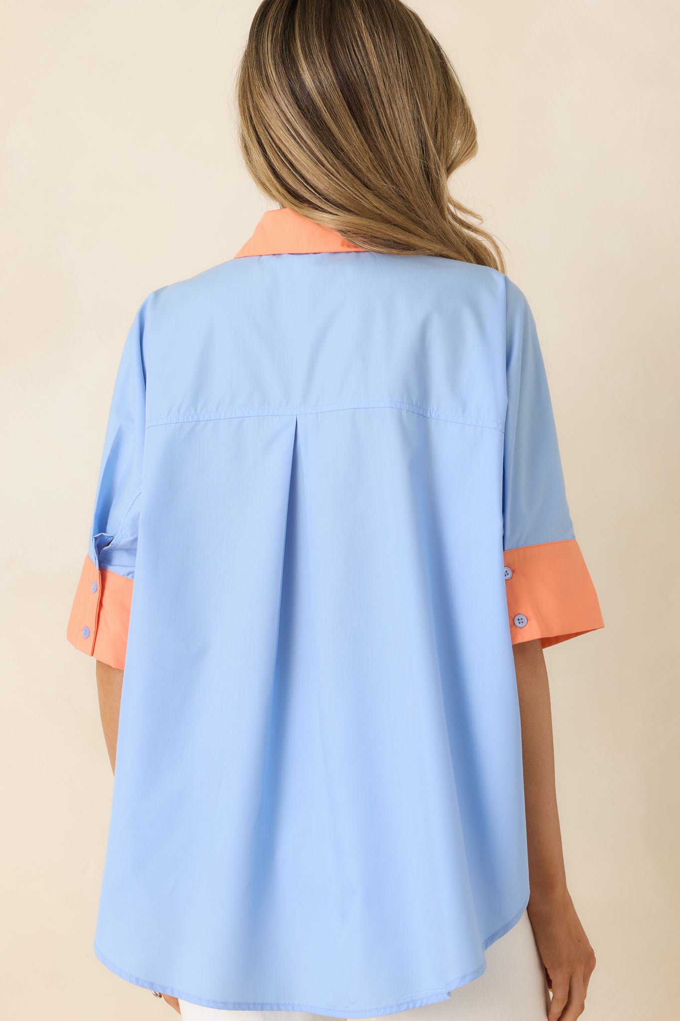 Rear view of the lightweight top, showing the relaxed silhouette and clean, structured finish.