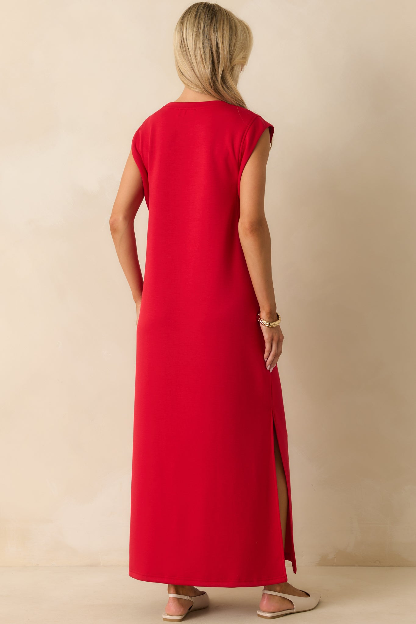 Rear view of the red maxi dress showing the relaxed fit and flowing hemline.