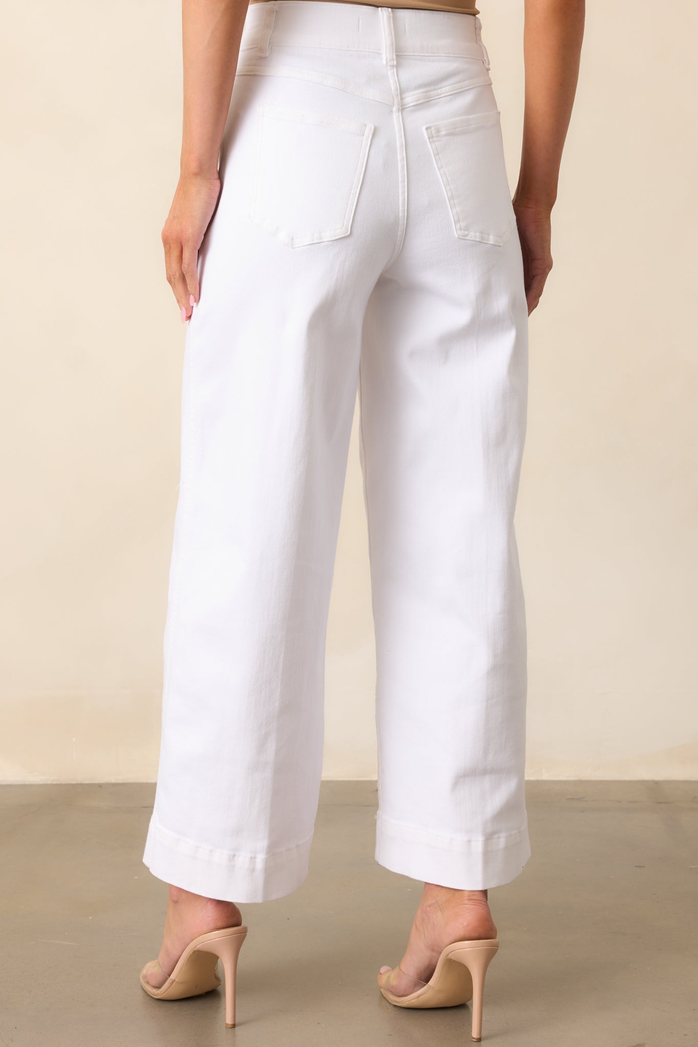 Rear view of the jeans showing the high-rise fit and seamless back with no pockets for a smooth finish.