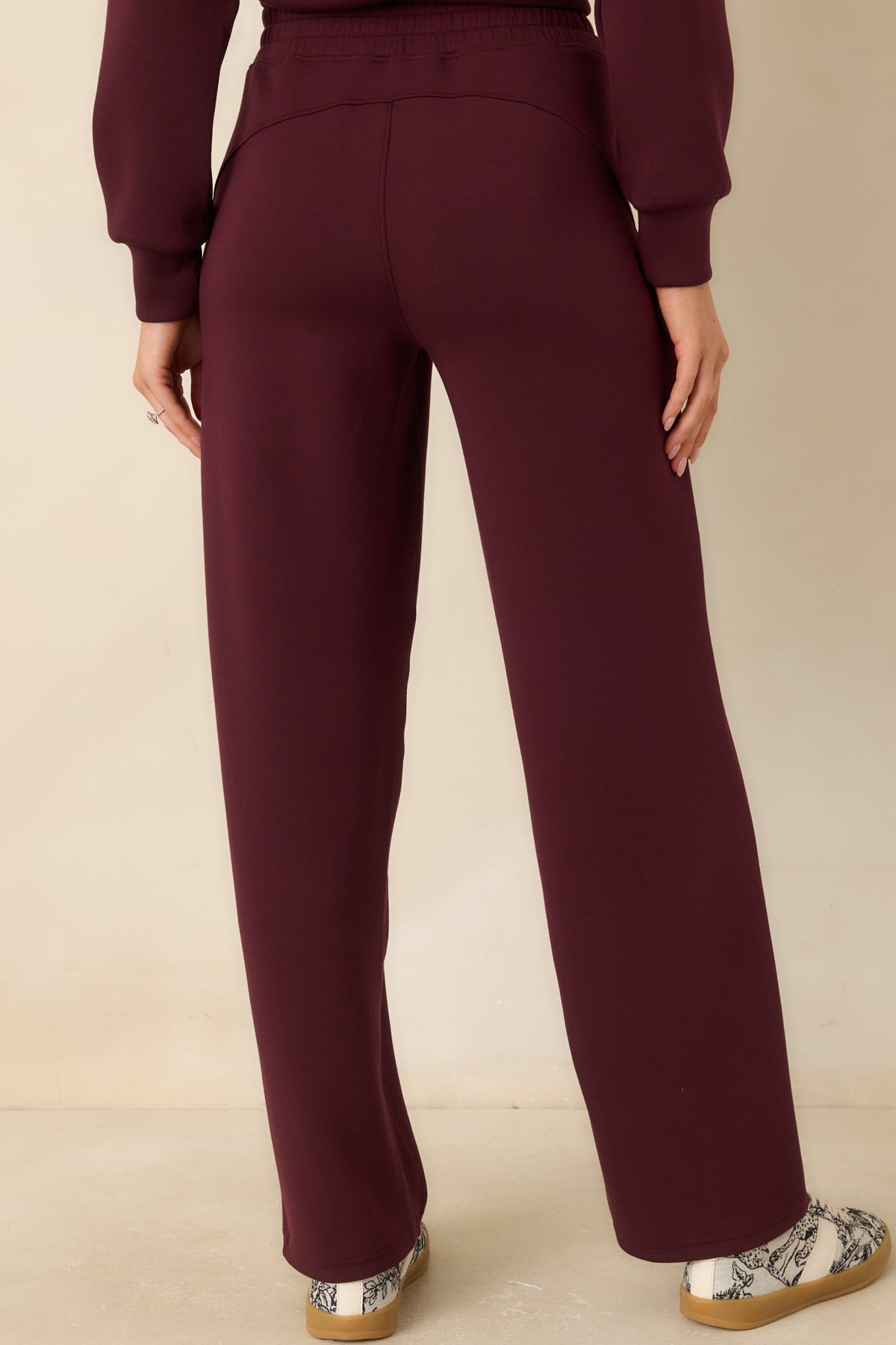Rear of the straight-leg spacer fabric pants, showing the smooth finish and relaxed drape.