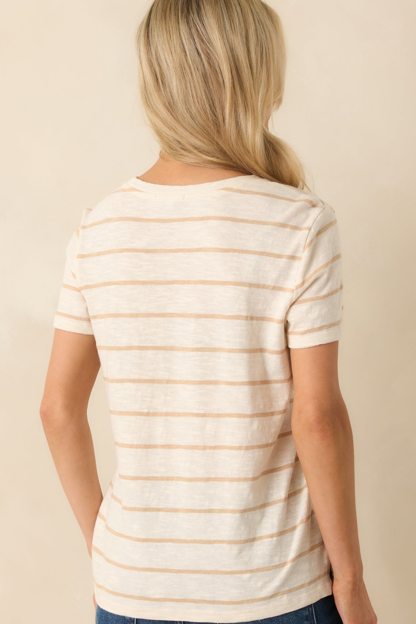 Rear view of striped cotton tee with classic short sleeve style.