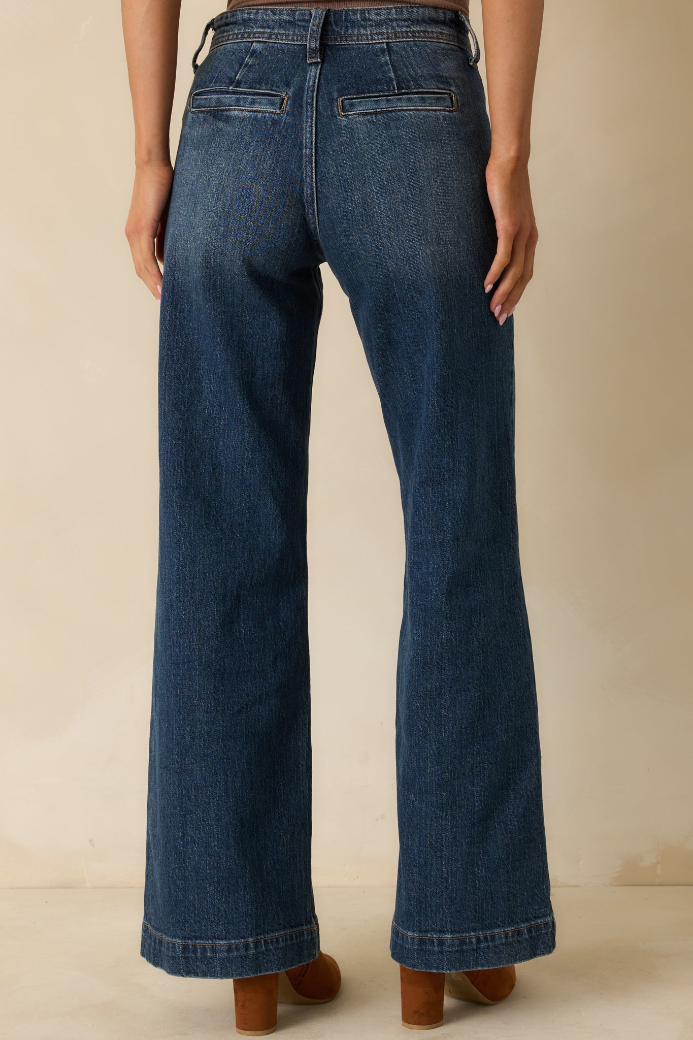 Rear view of the wide-leg jeans showing back welt pockets and relaxed high-rise fit.