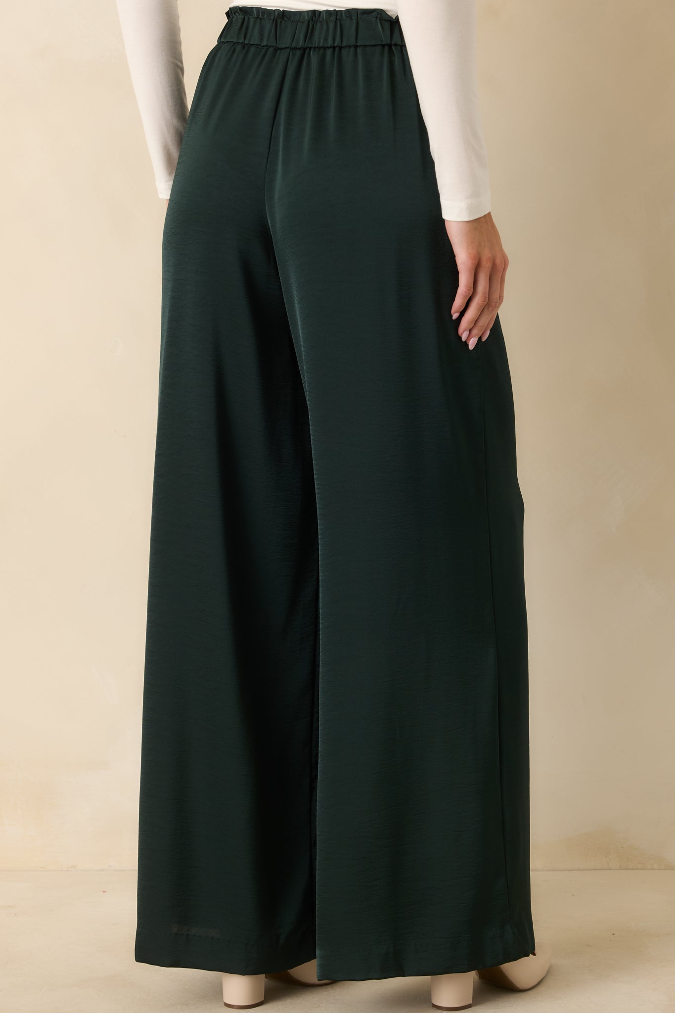 Rear view highlighting the wide-leg cut, relaxed fit, and elastic waistband at back.