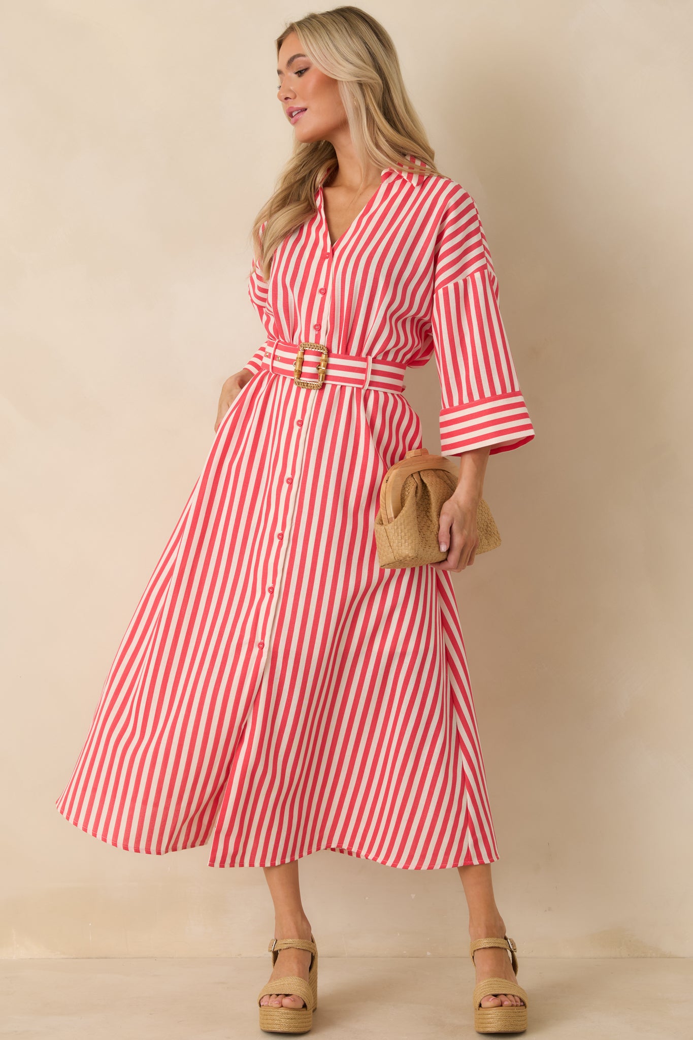Red and white striped maxi dress featuring a button-front closure and relaxed silhouette with everyday appeal