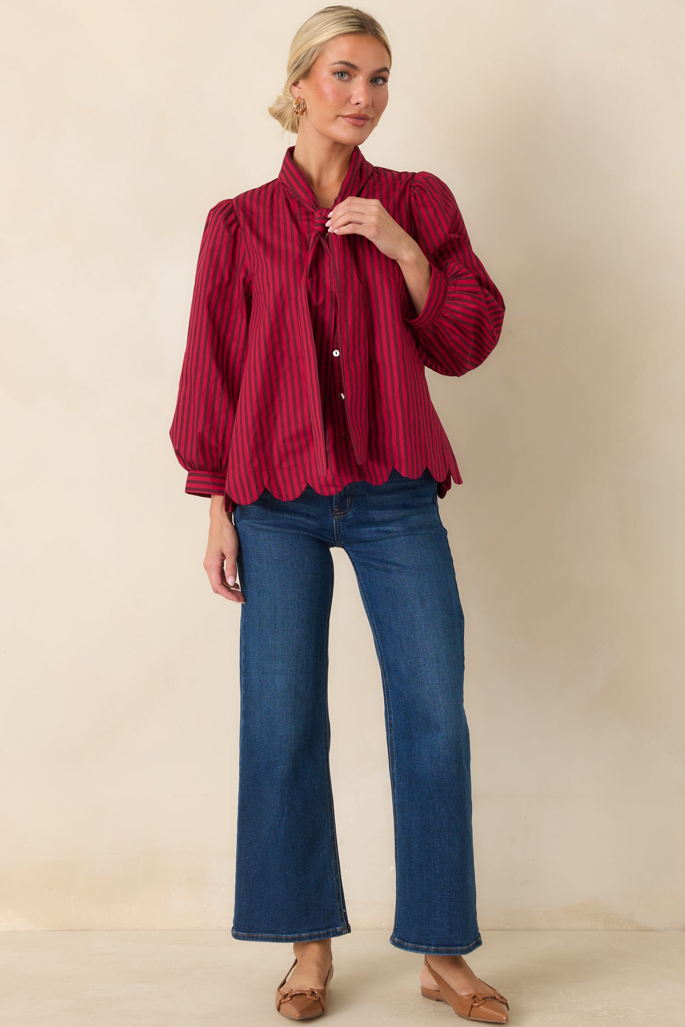 Candy red and dark brown striped cotton blouse featuring a self-tie neckline, gathered shoulders, 3/4 sleeves, and scalloped hem.