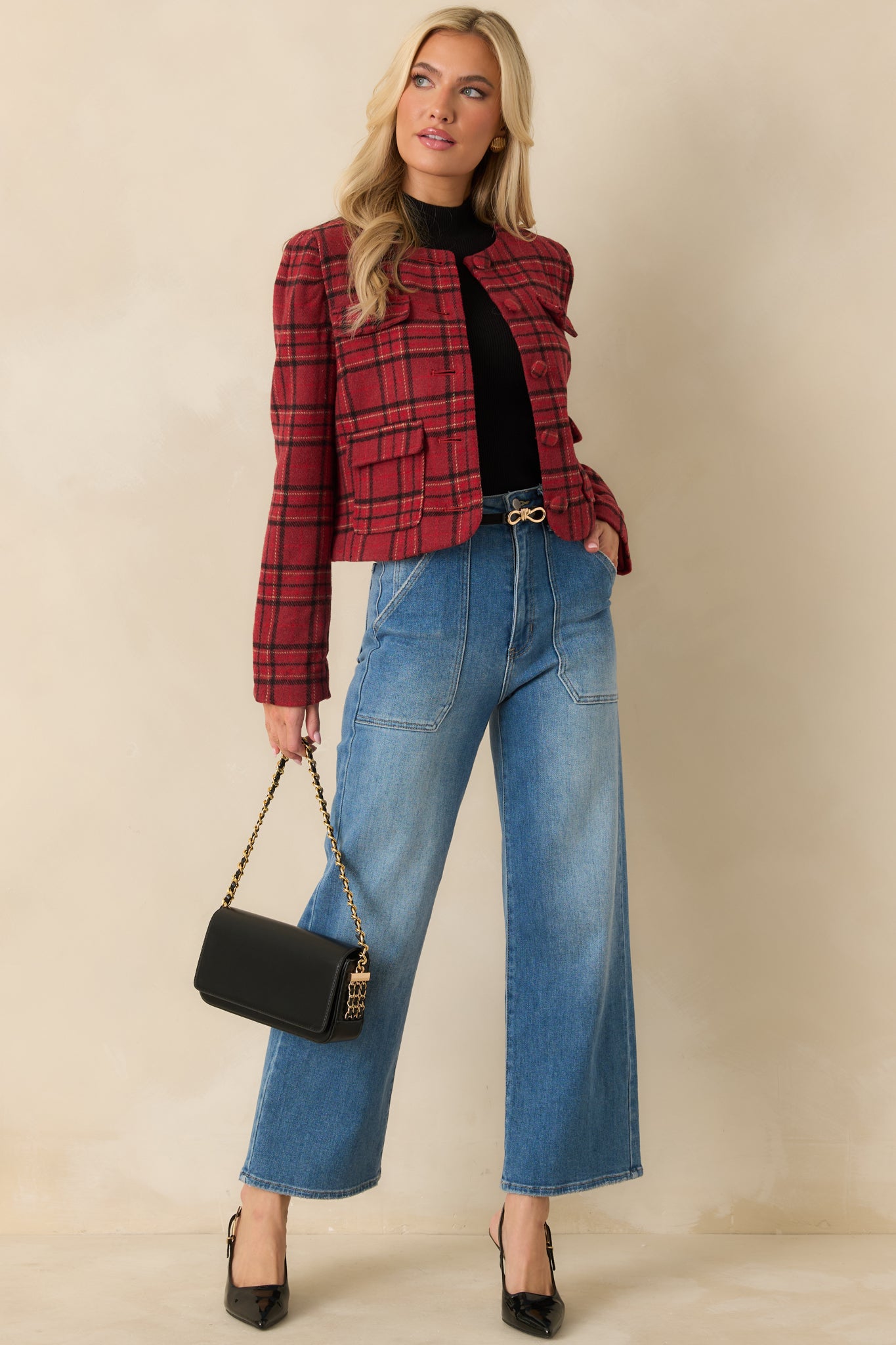 Red cropped plaid jacket with round neckline, long sleeves, and front buttons.