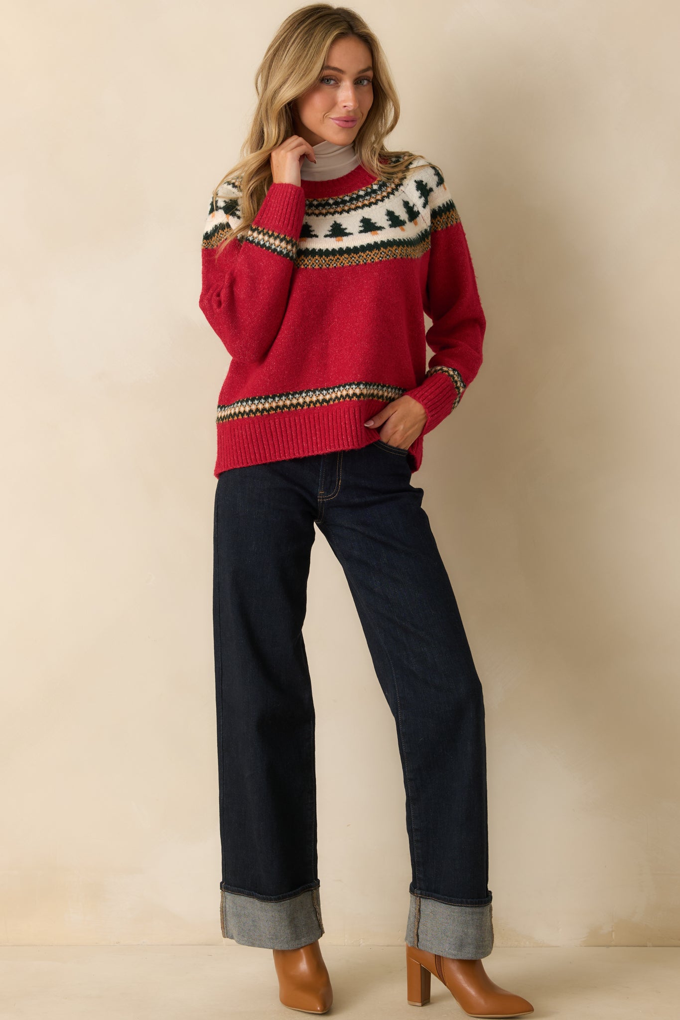 Full-length image highlighting the red Fair Isle sweater’s festive design and soft knit texture.